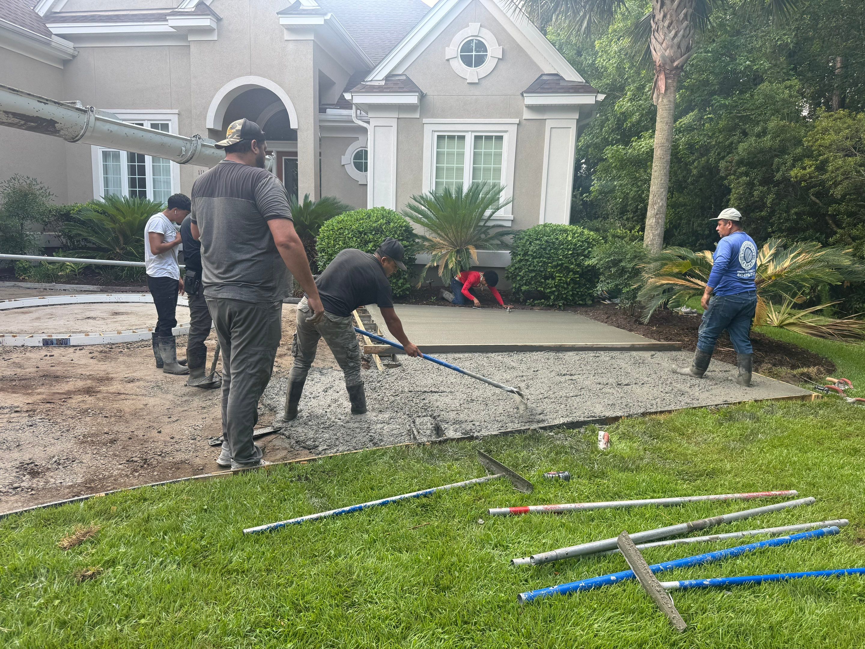 Custom Concrete Driveway and Decorative Paver Installation in Bluffton by Lowcountry Scapes, LLC