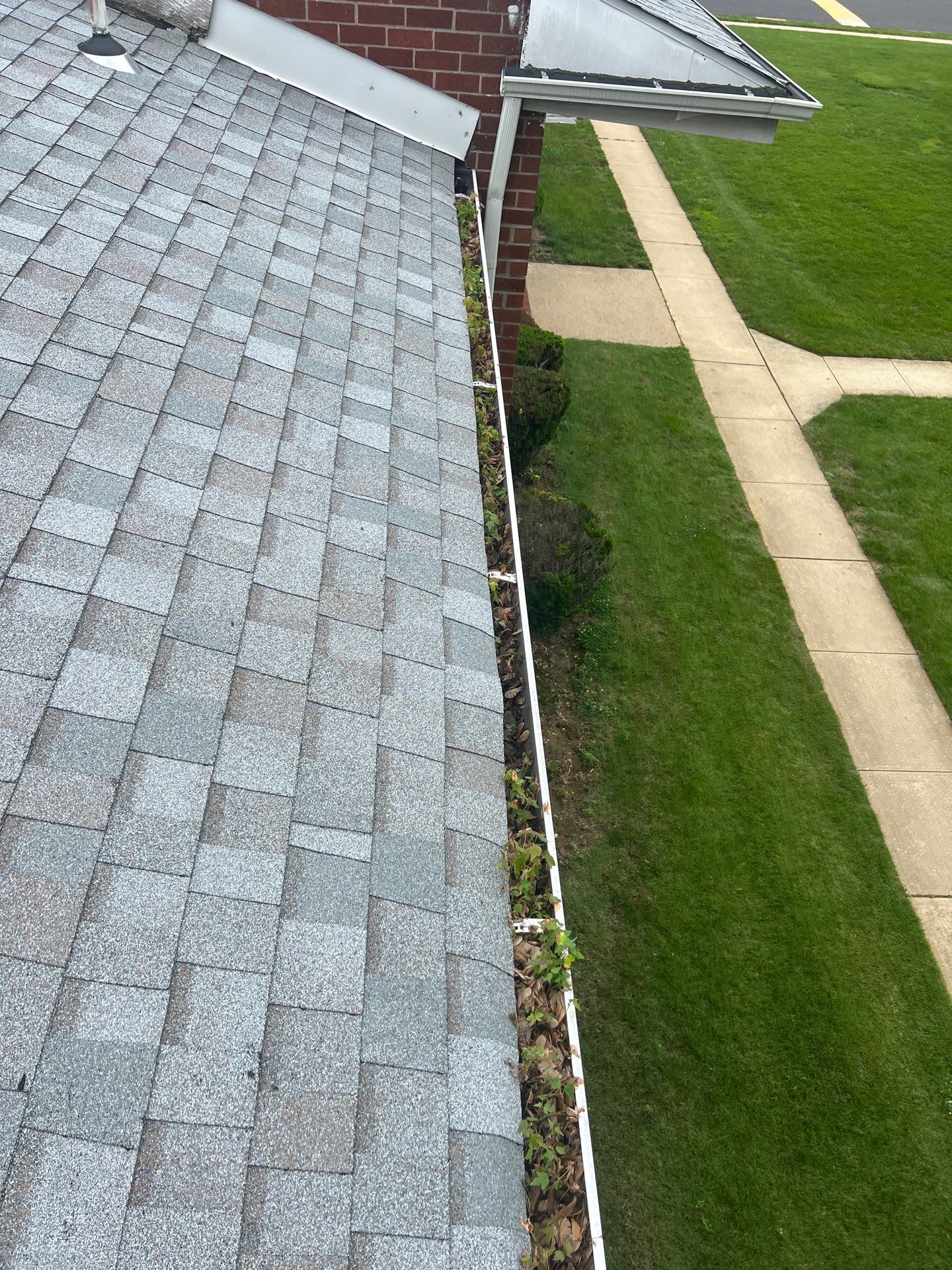 Commercial gutter cleaning Trenton, NJ before photo with filled gutters