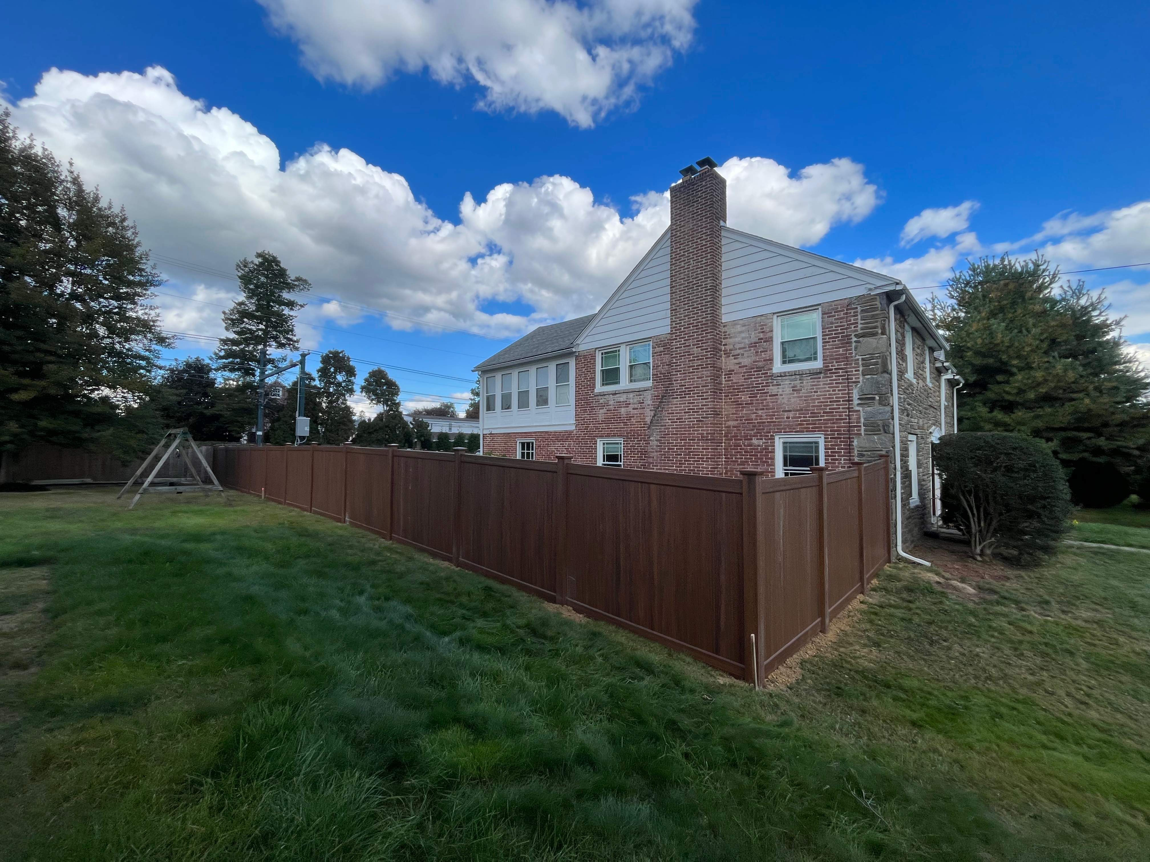 6' High Mocha Walnut Vinyl Installation by Jensen Fencing