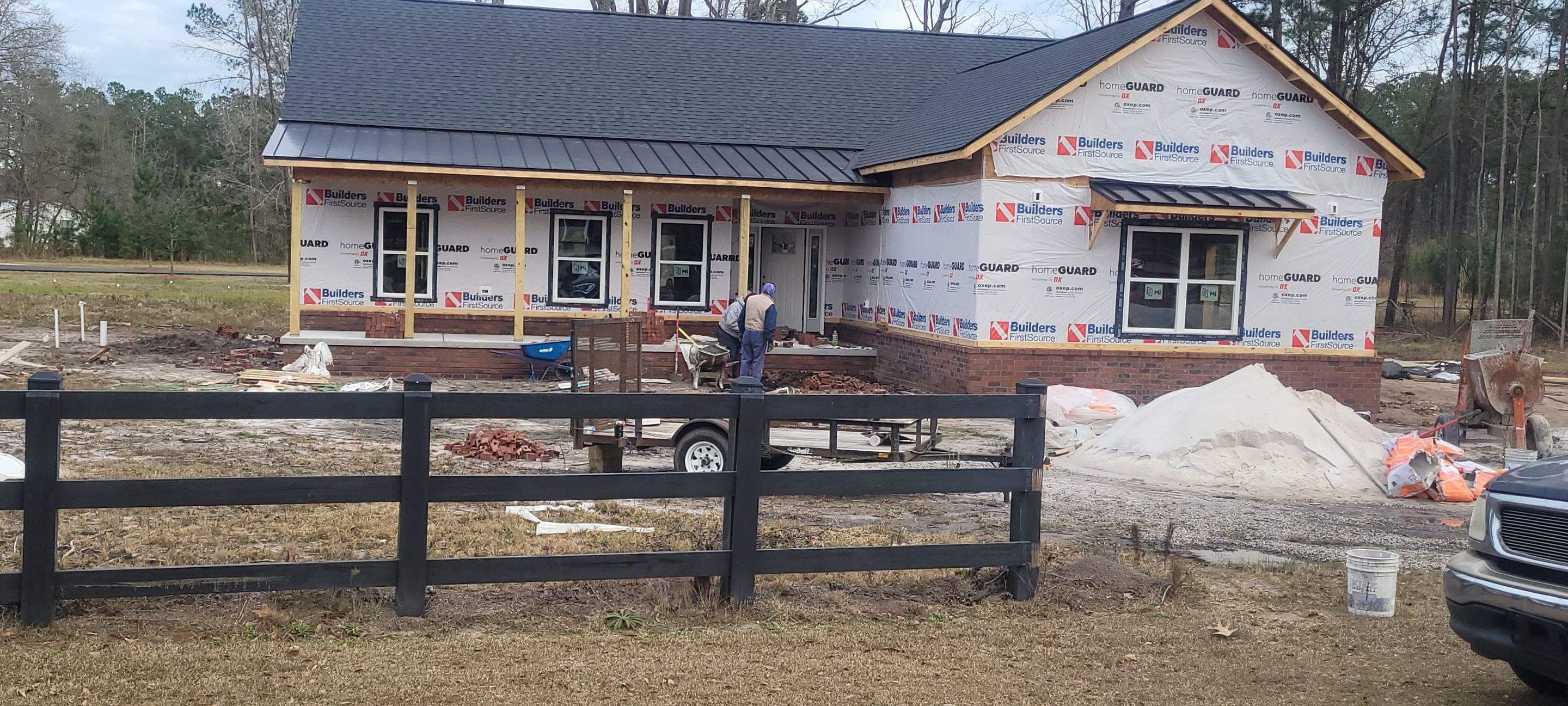 New Home Construction using brick and vertical vinyl by Cornerstone Home Builders, LLC