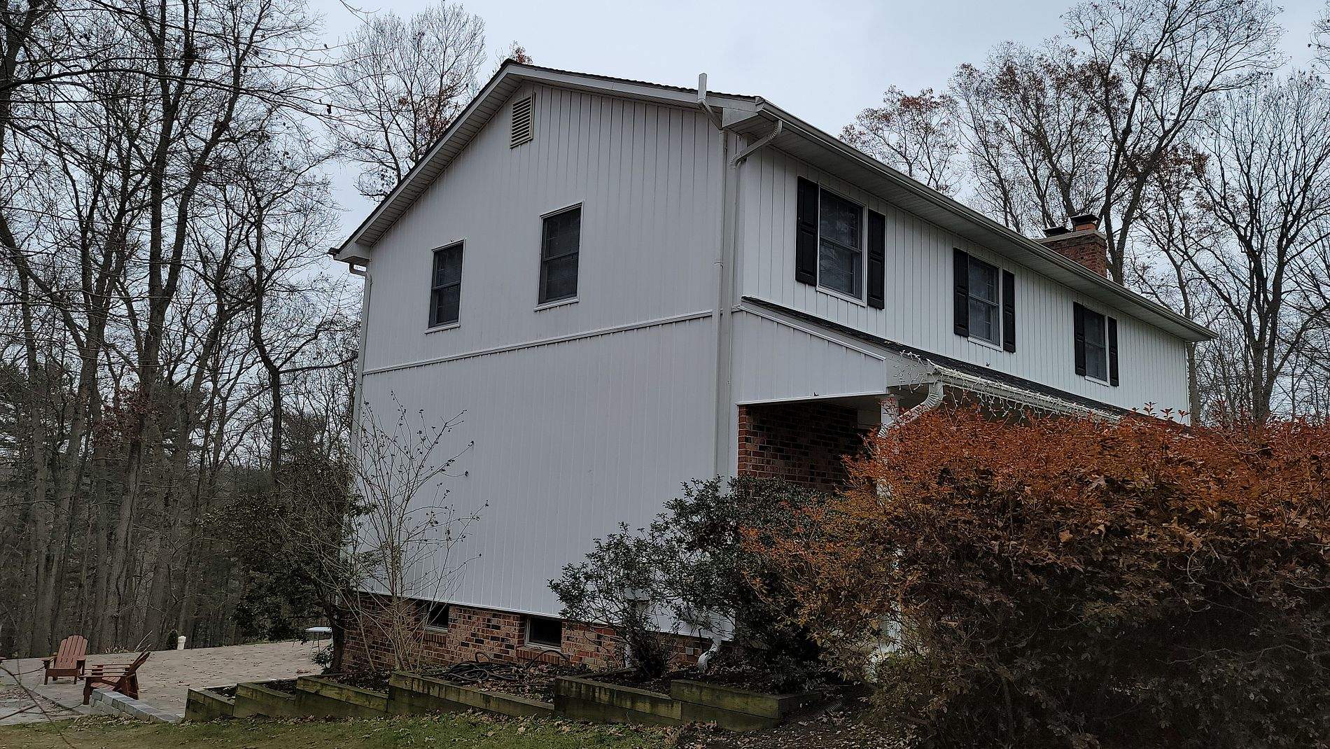 White Board & Batten Siding with Black Trim by Roof Right Inc