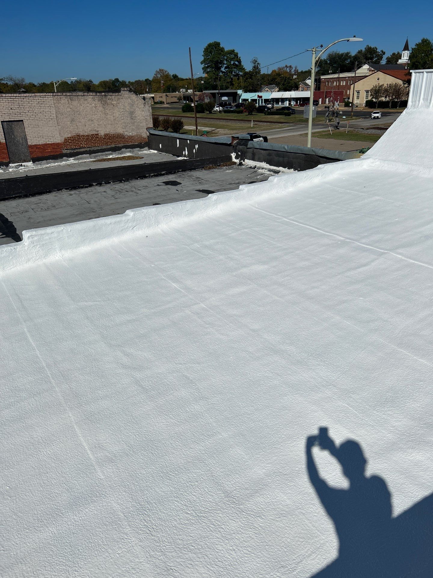 Downtown Gladewater Commercial Foam Roof Restoration – SPF + High-Tensile Acrylic by All Star Roofing LLC