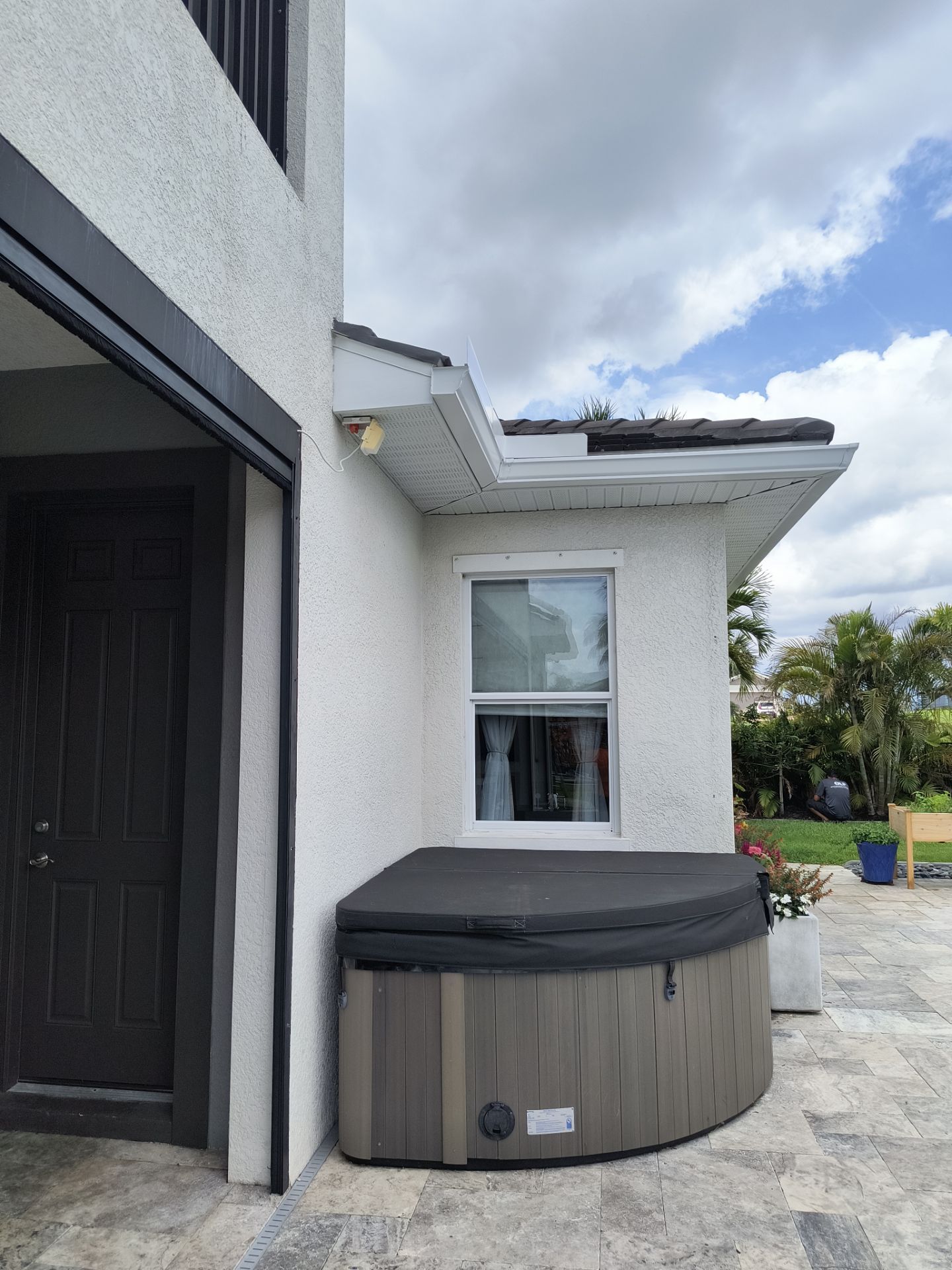 White Seamless Gutters with Downspouts in Bradenton FL by Gutter Professors