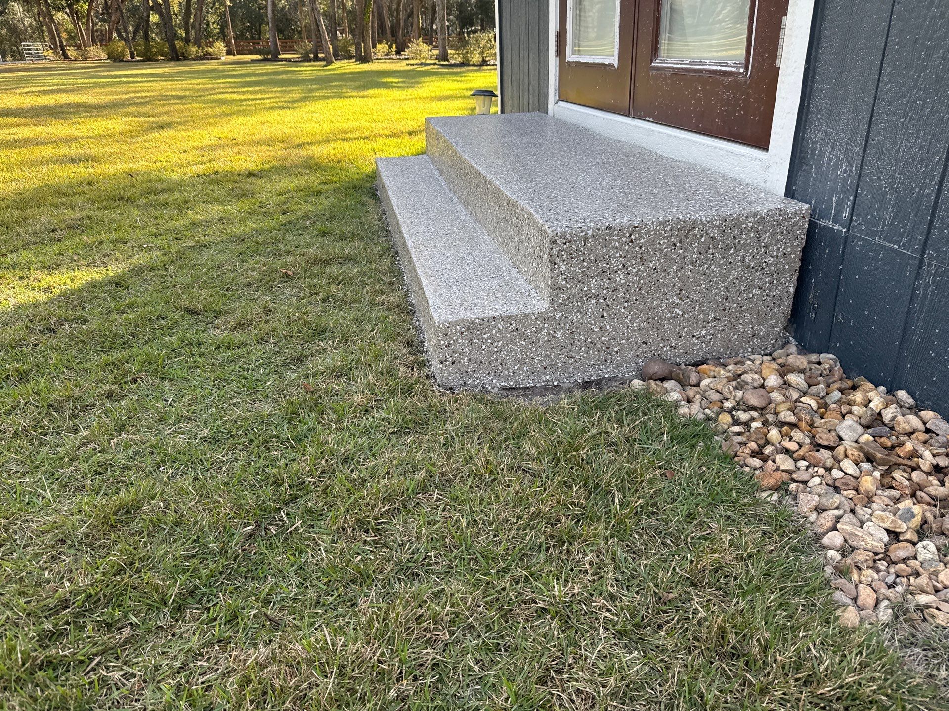 Front and Back Porches in Chiefland, FL in Pebble Beach by Cross Creek Concrete Coatings