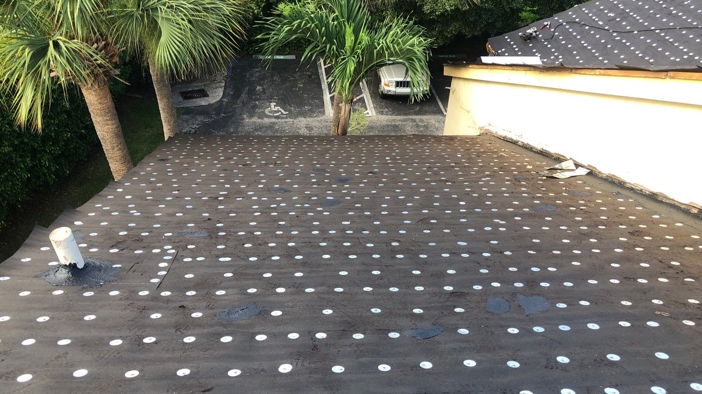 Commercial Roofing Installation using 1" Nail strip metal roof by BLUES BROTHERS ROOFING