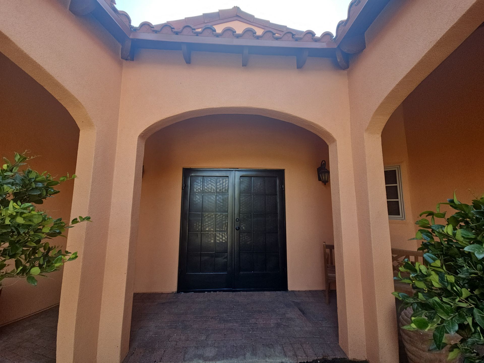 Exterior Painting with Stucco Damage by Regal Renovate