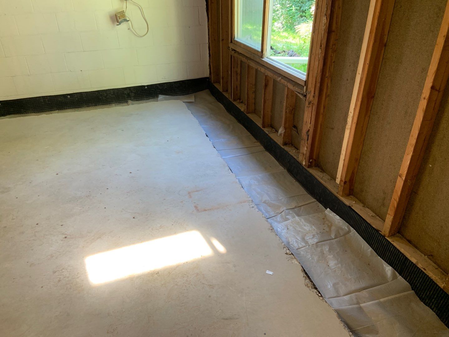 Correcting an Improper Installation for Alan in Chanhassen by Waterproofing Northeast