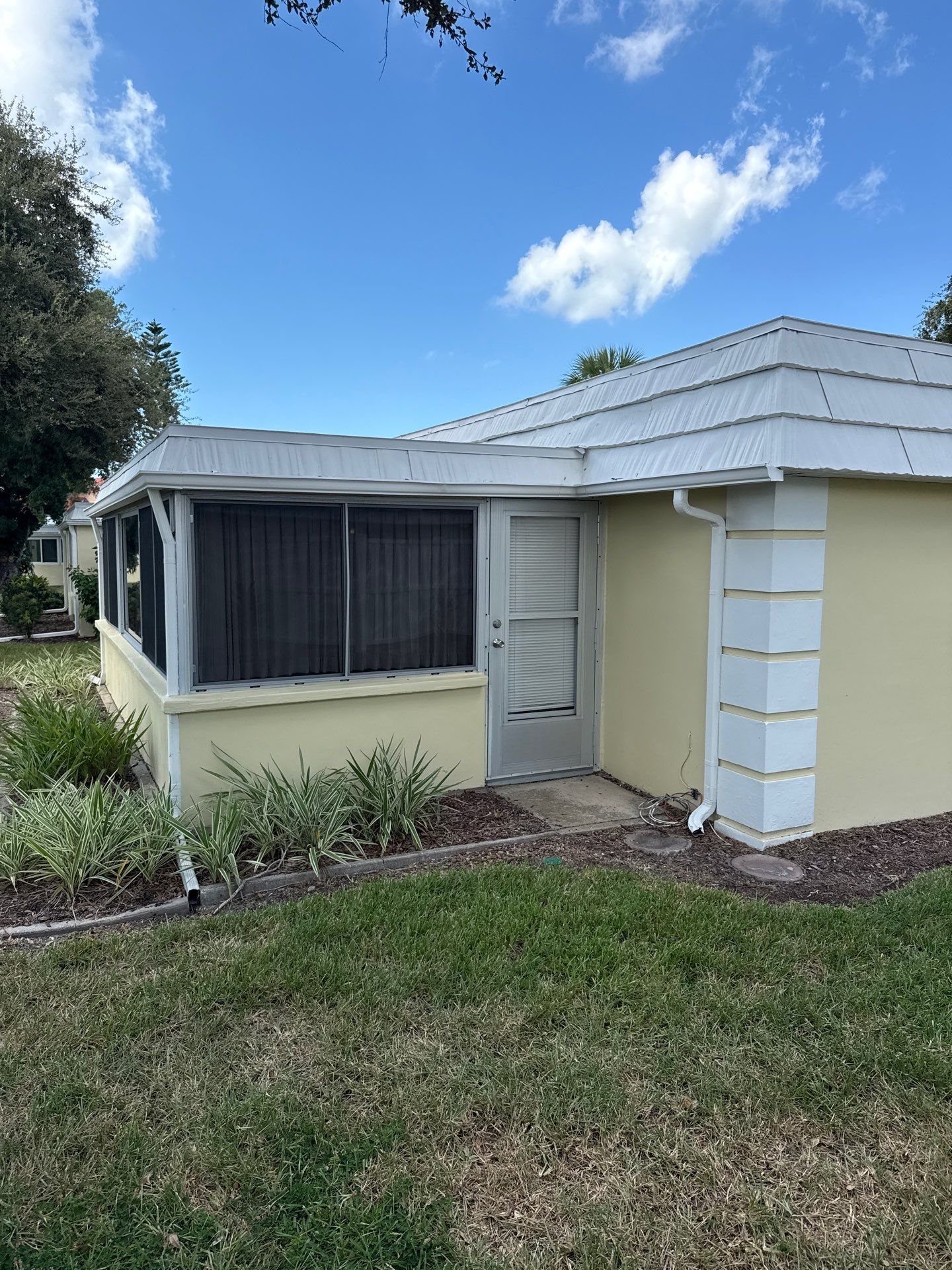 White Gutters and Matching Downspouts in Sarasota FL by Gutter Professors