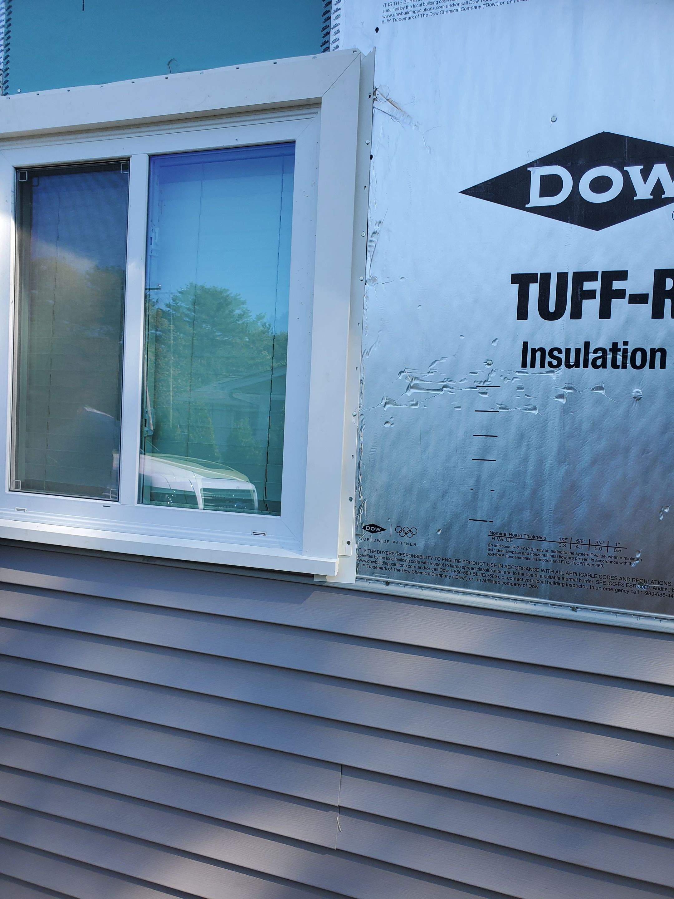 Siding Installation using insulation, PVC trim and vinyl siding by UBrothers Construction