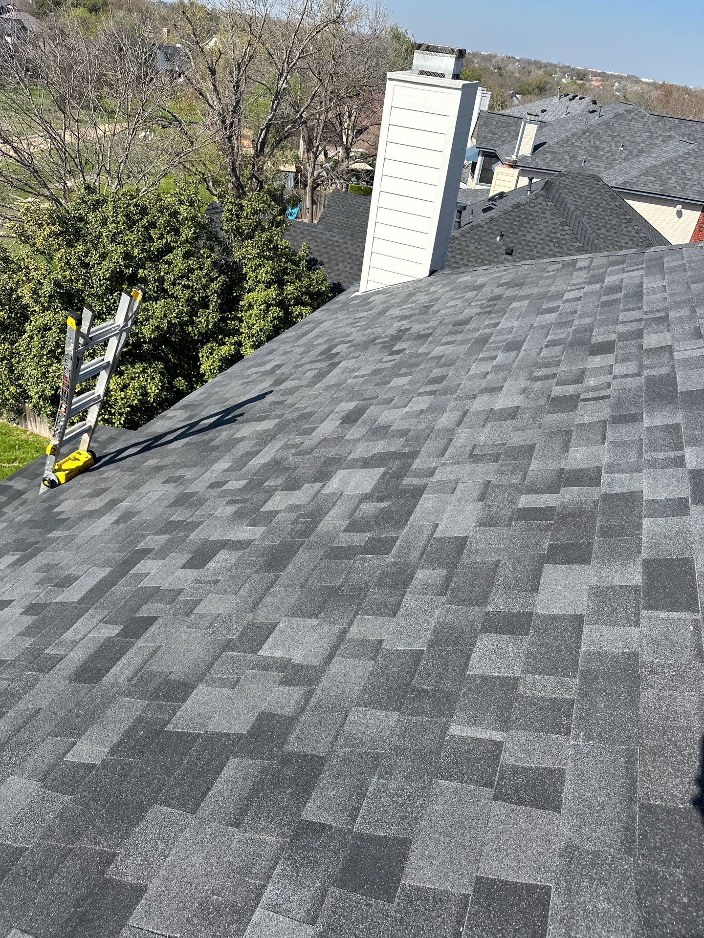 Residential Roofing Installation using Malarkey Vista Class 3 Matte Black by DeZign Roofing & Exteriors