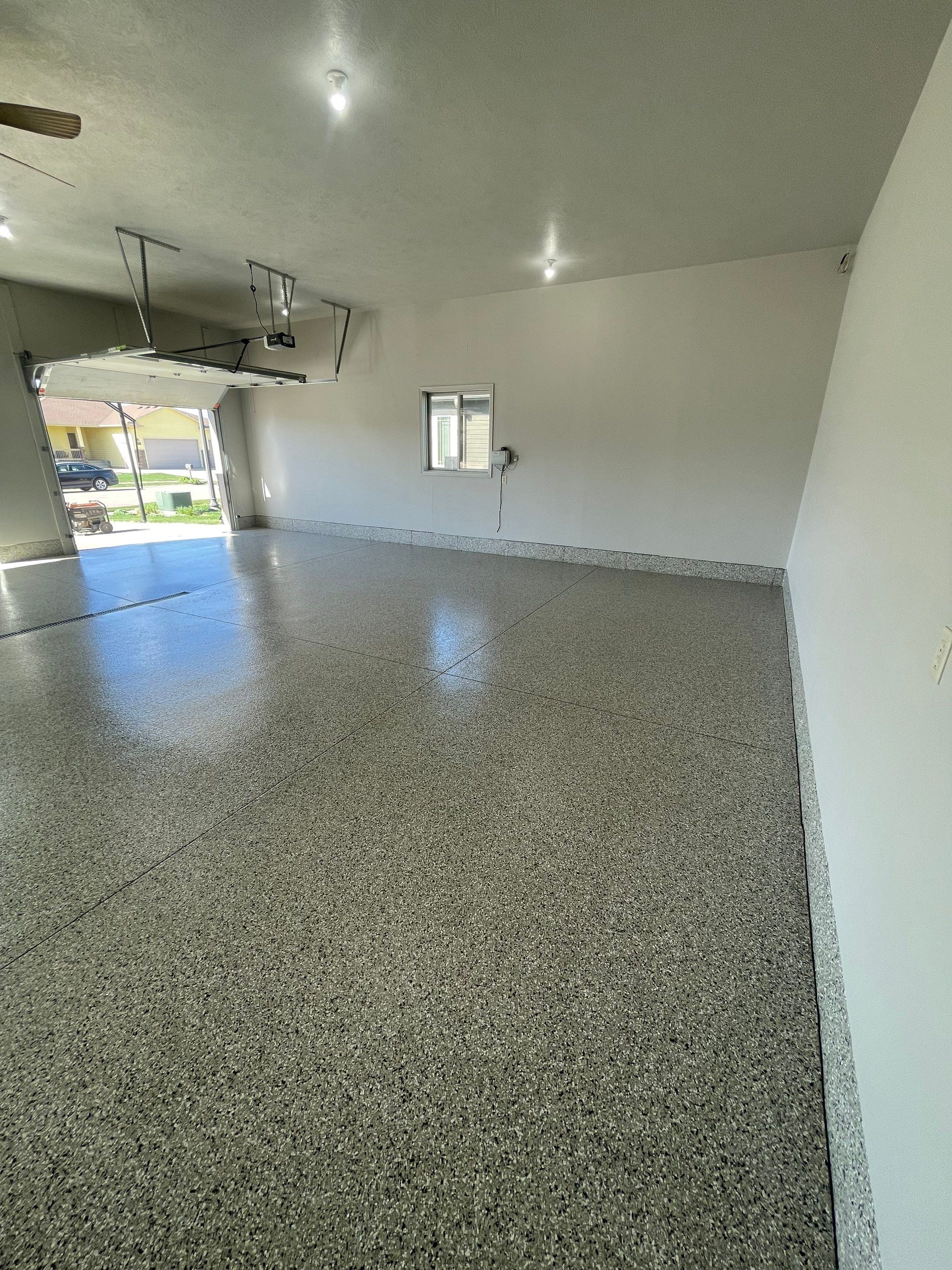 Multi-Car Garage Epoxy Floor Coating in Beresford by Select Painting, Coatings & Garage Cabinets