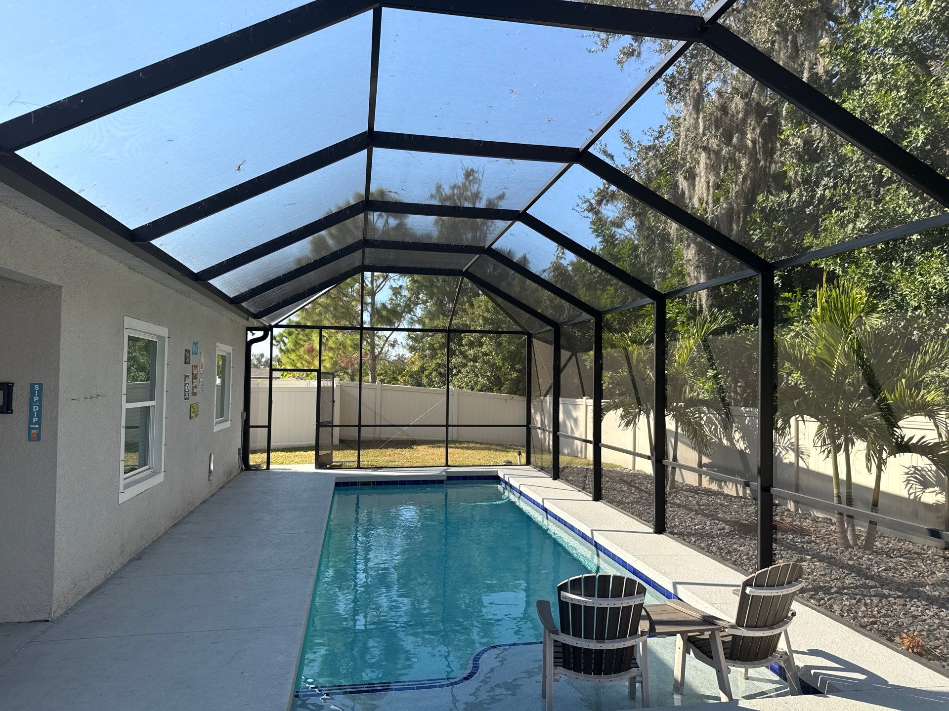 Painted Pool Deck & Screen Enclosure Cleaning | Heron Creek, Palmetto FL by Sunshine AquaWash