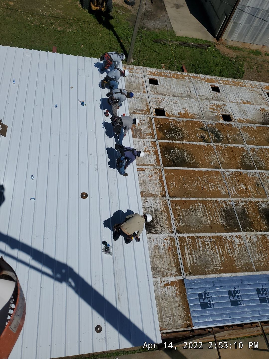 Commercial Roofing Installation using Aluminum Roofing panels by Hostetler Roofing