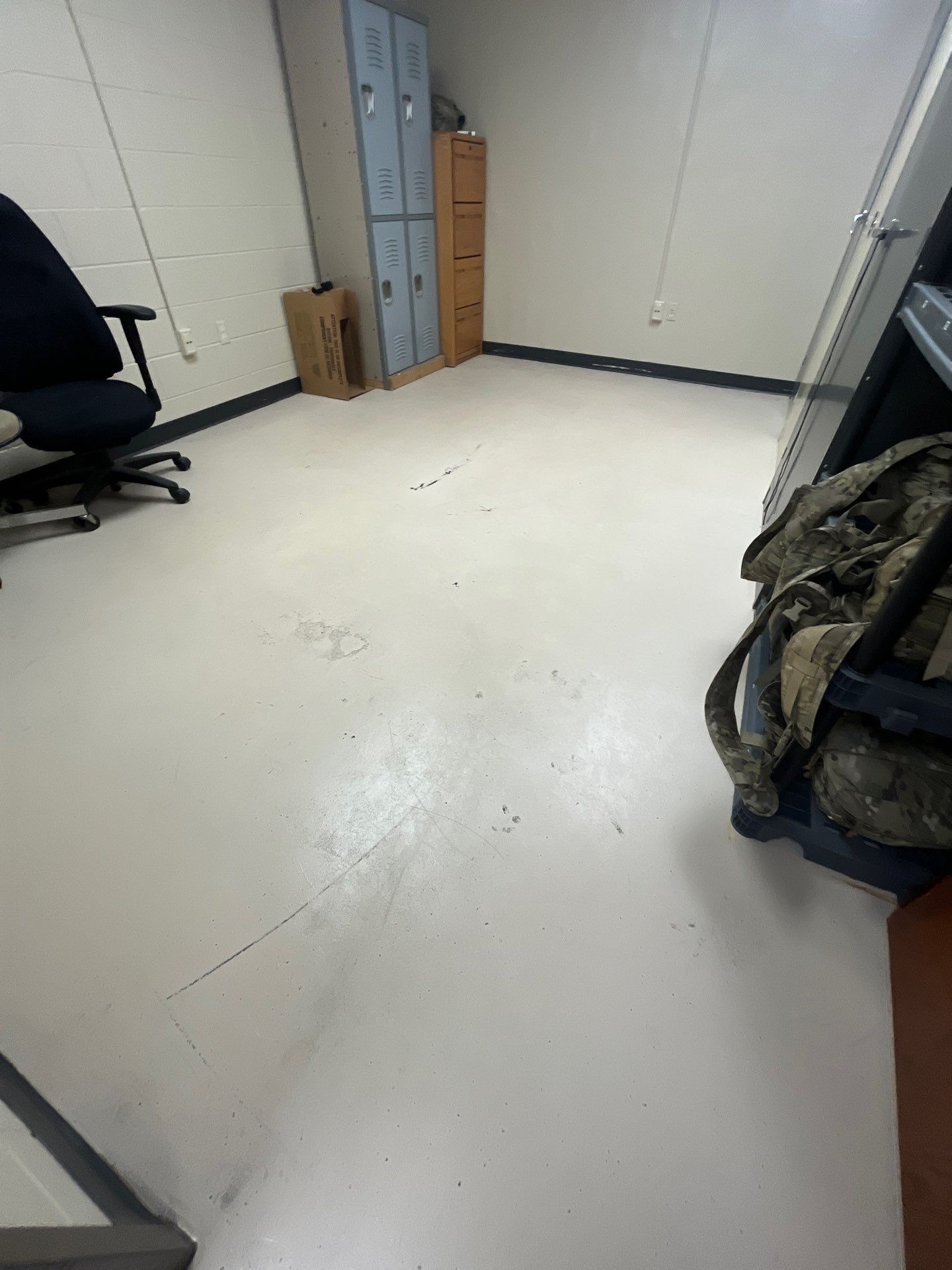 Industrial Flake Epoxy Floor Installation at Pierre National Guard Facility by Select Painting, Coatings & Garage Cabinets