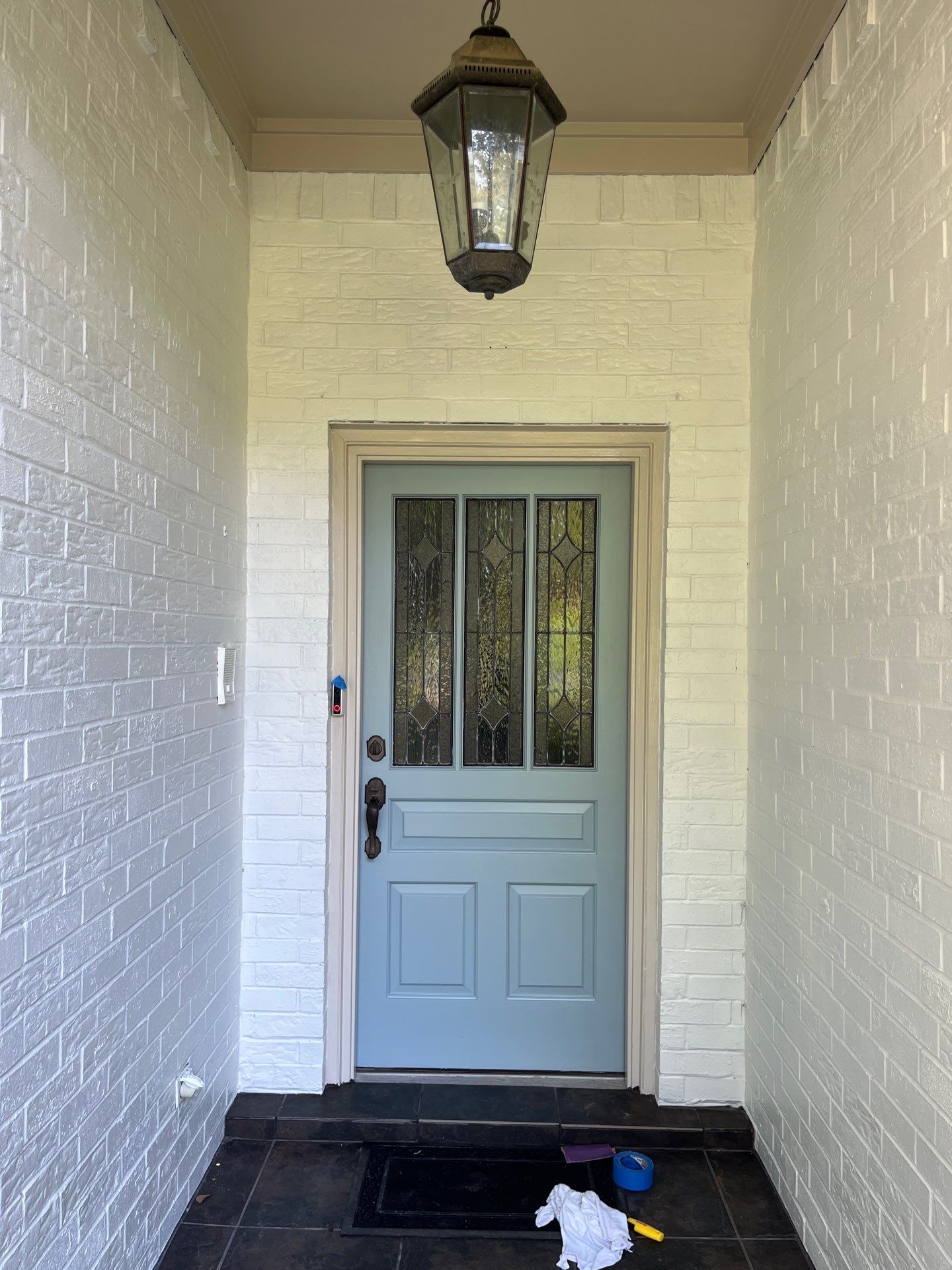 Exterior Painting in Tyler, TX | Brick House with White & Blue Finish by Quality Coats Painting