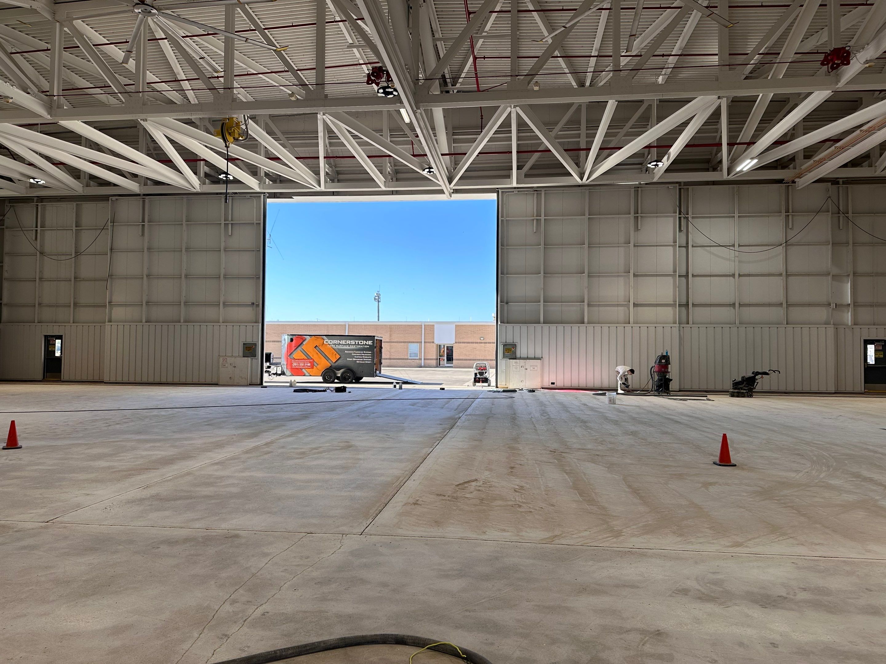 Industrial Epoxy Flooring for Army National Guard Hangar in Mobile by Cornerstone Hard Surface Restoration 