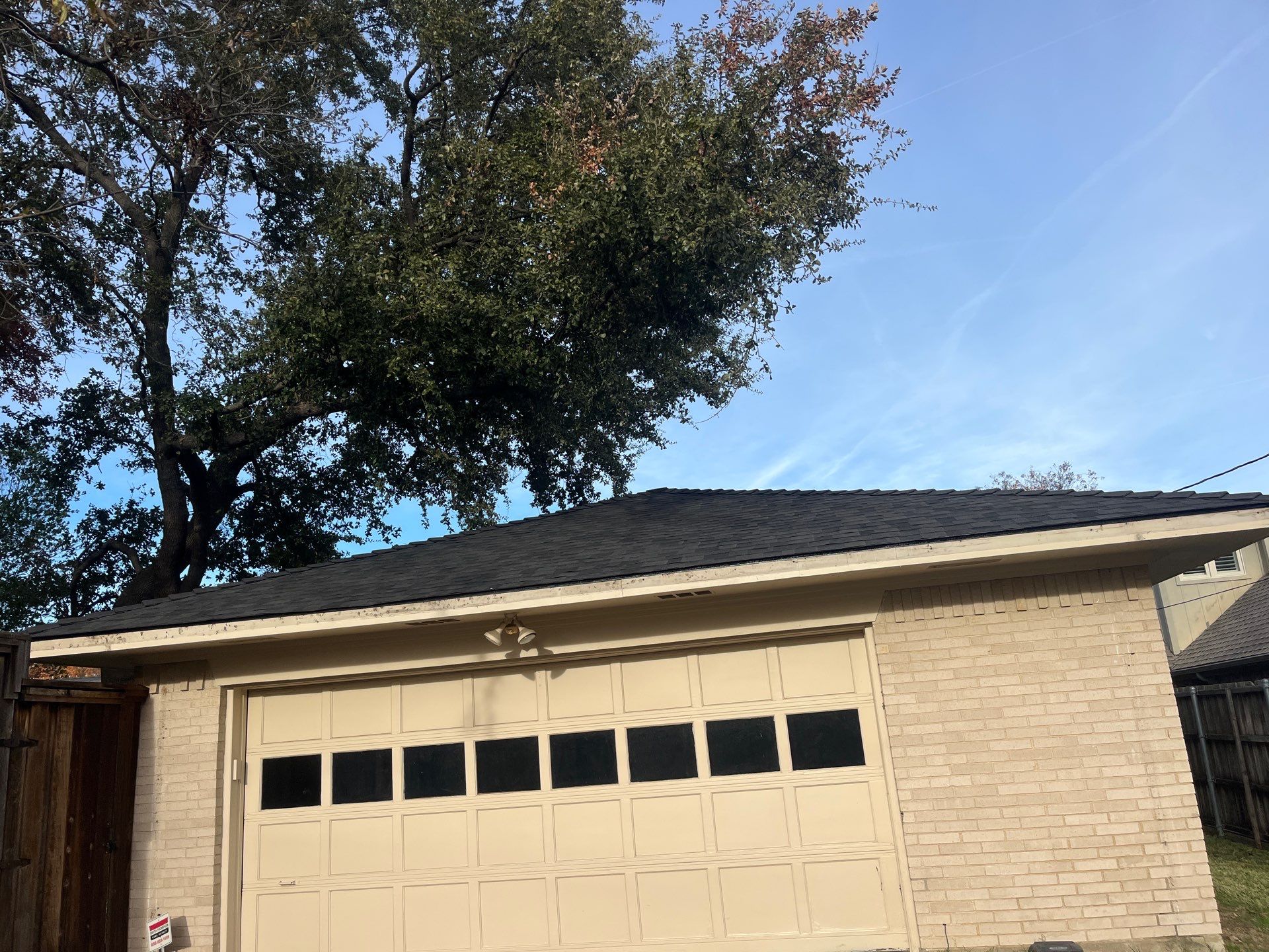 IKO Brownstone- White Brick  by Tejas Roofworks + Restoration