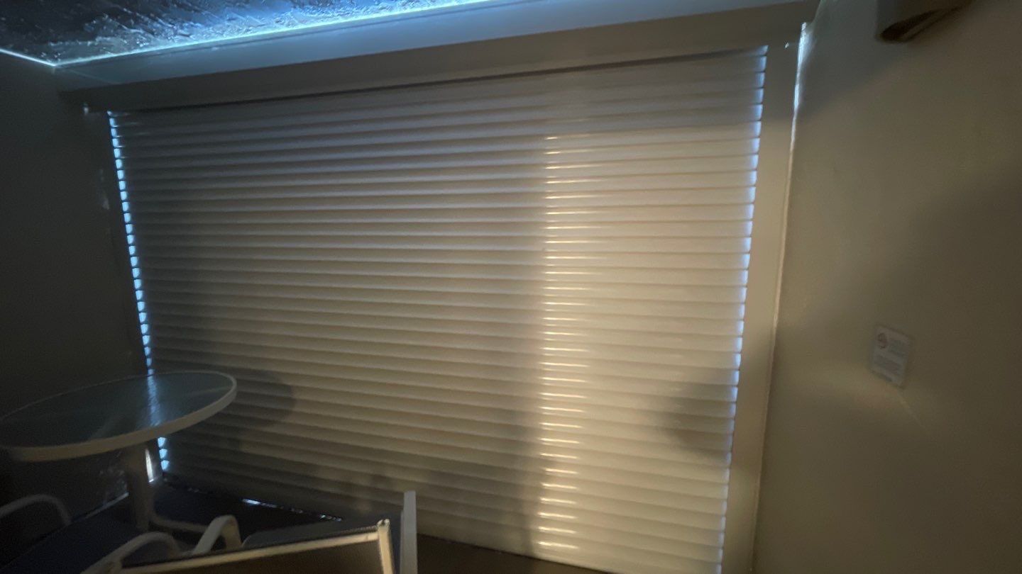Motorized shutters on lanai by Smart Guard Shutters