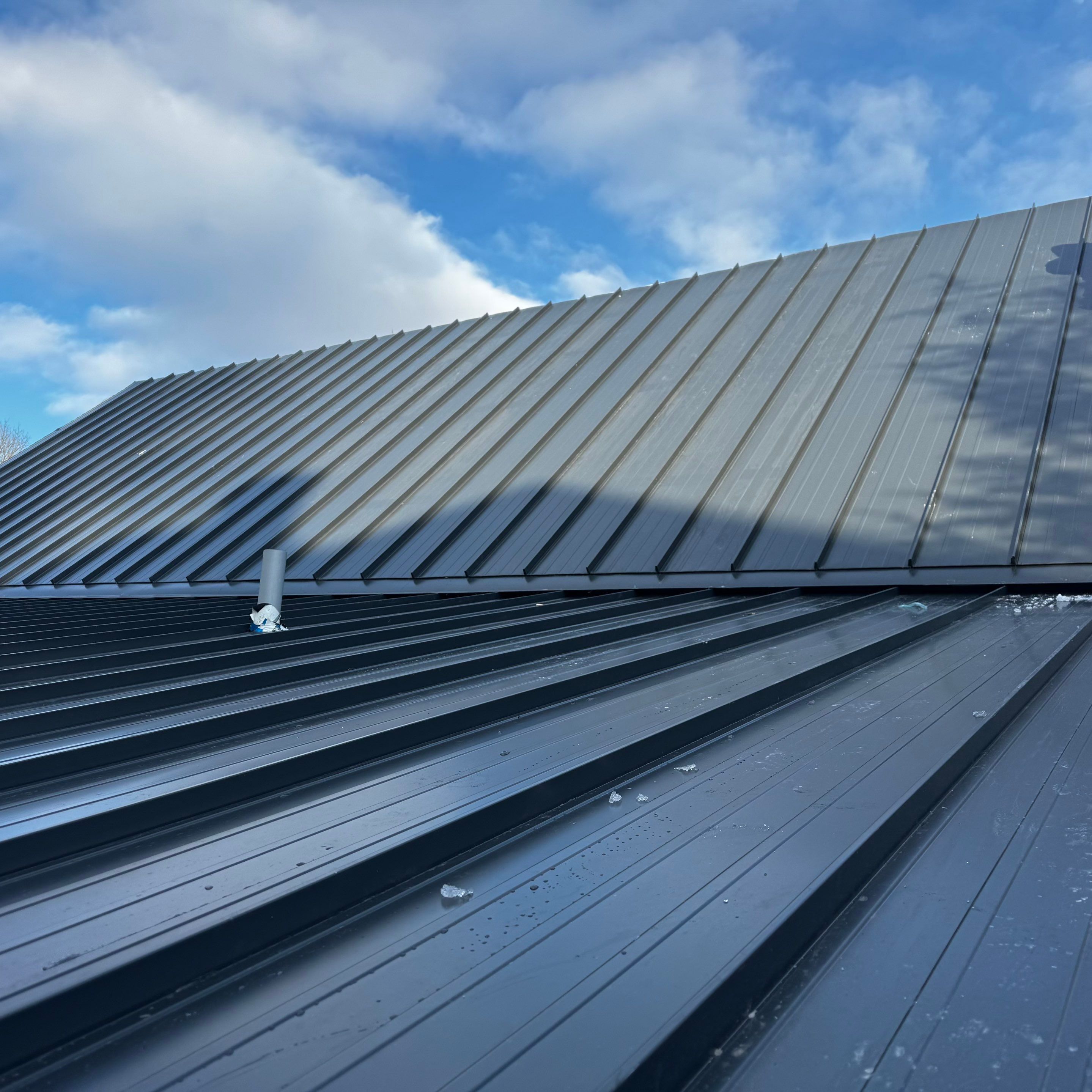 Commercial Roofing Installation using 16" Standing Seam Panels by Jay Carter Roofing & Sheet Metal