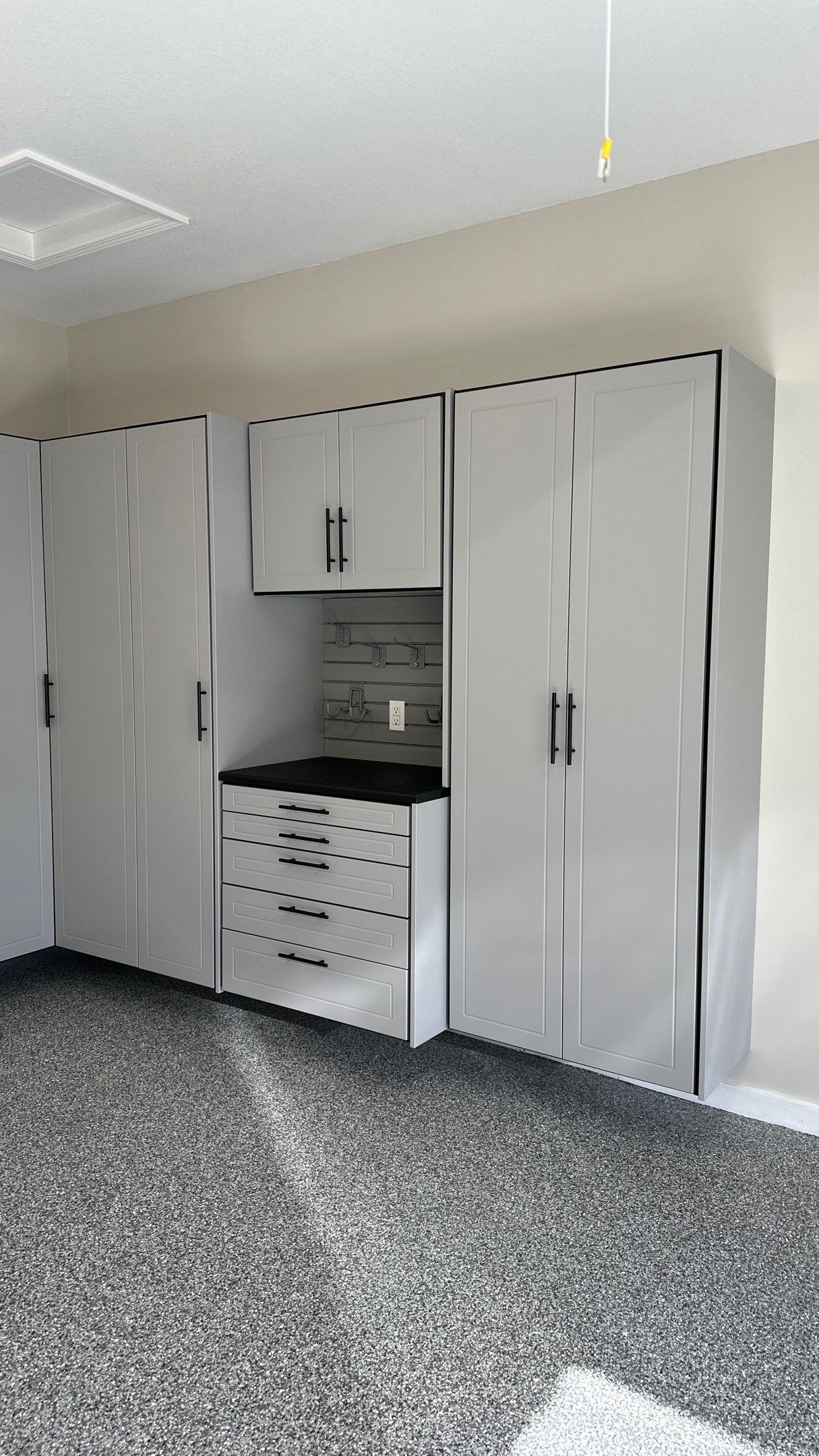 Macy T. transformed her garage with our beautiful cabinets by Banner Garage