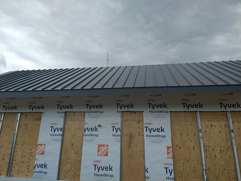Commercial Roofing Installation using Metal roof  by Absolute Roofing and Construction