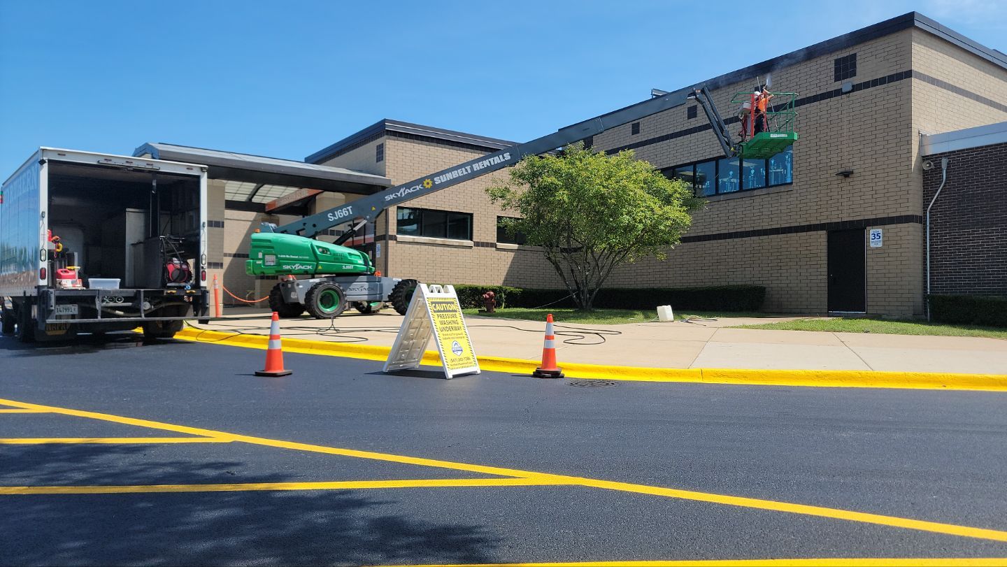 commercial pressure washing using Algaecide, soft wash soap by Northern Power Washing LLC.