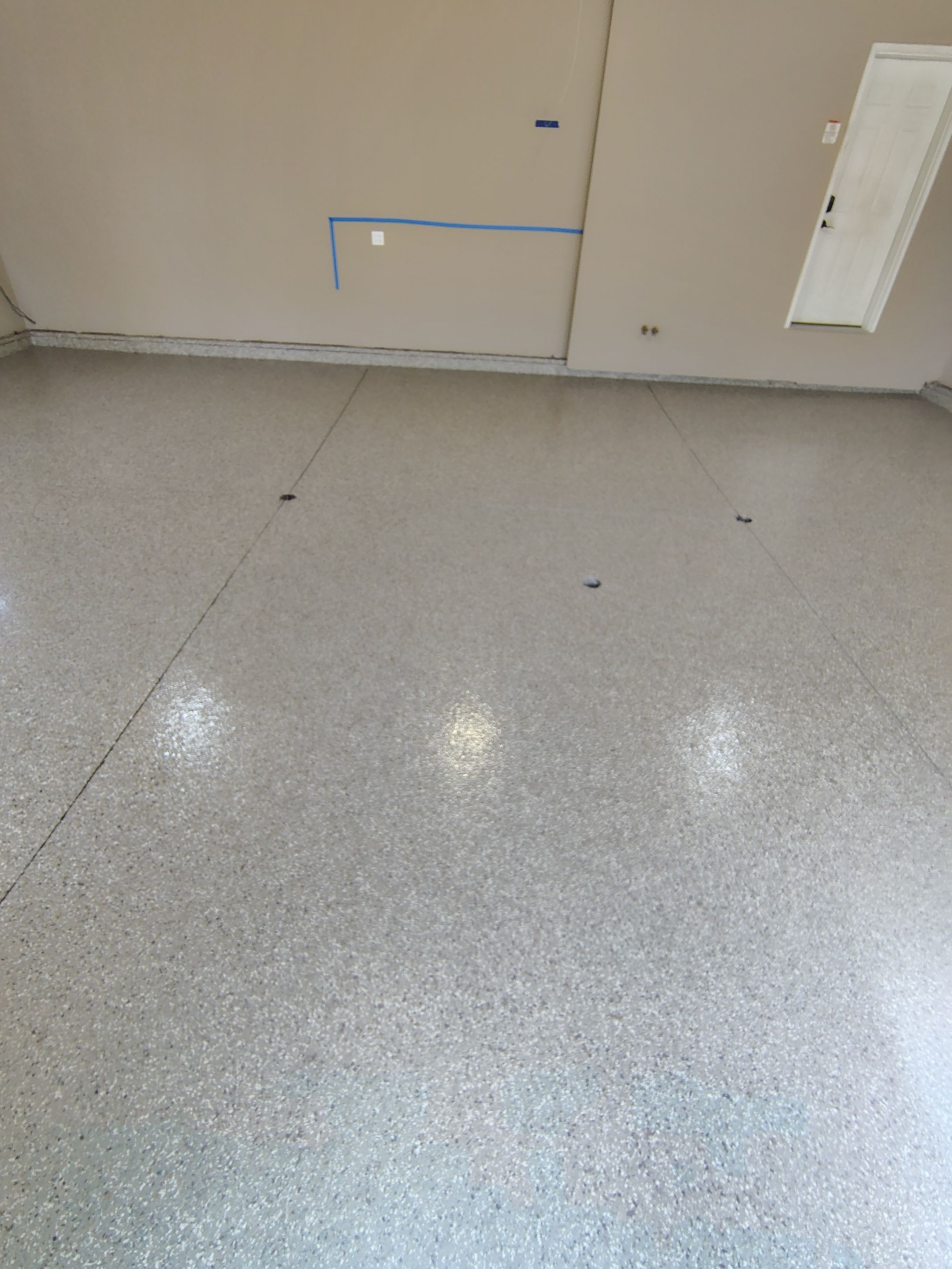 Sioux Falls Garage Concrete Repair and Epoxy Flake Floor Coating by Select Painting, Coatings & Garage Cabinets