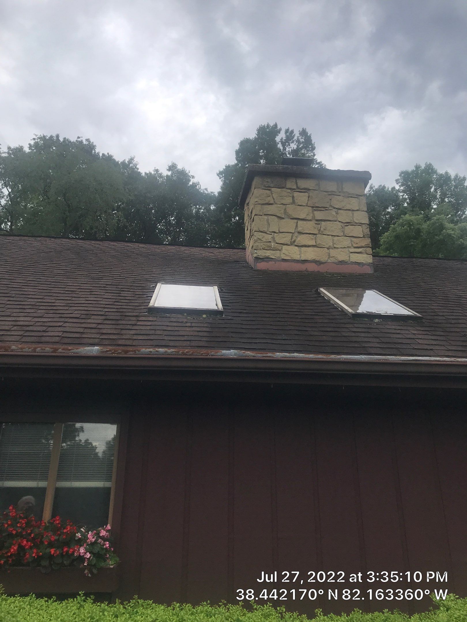 Shingle Roofing with Velux Skylight replacement and stone chimney flashing  by Secure Construction Company Inc