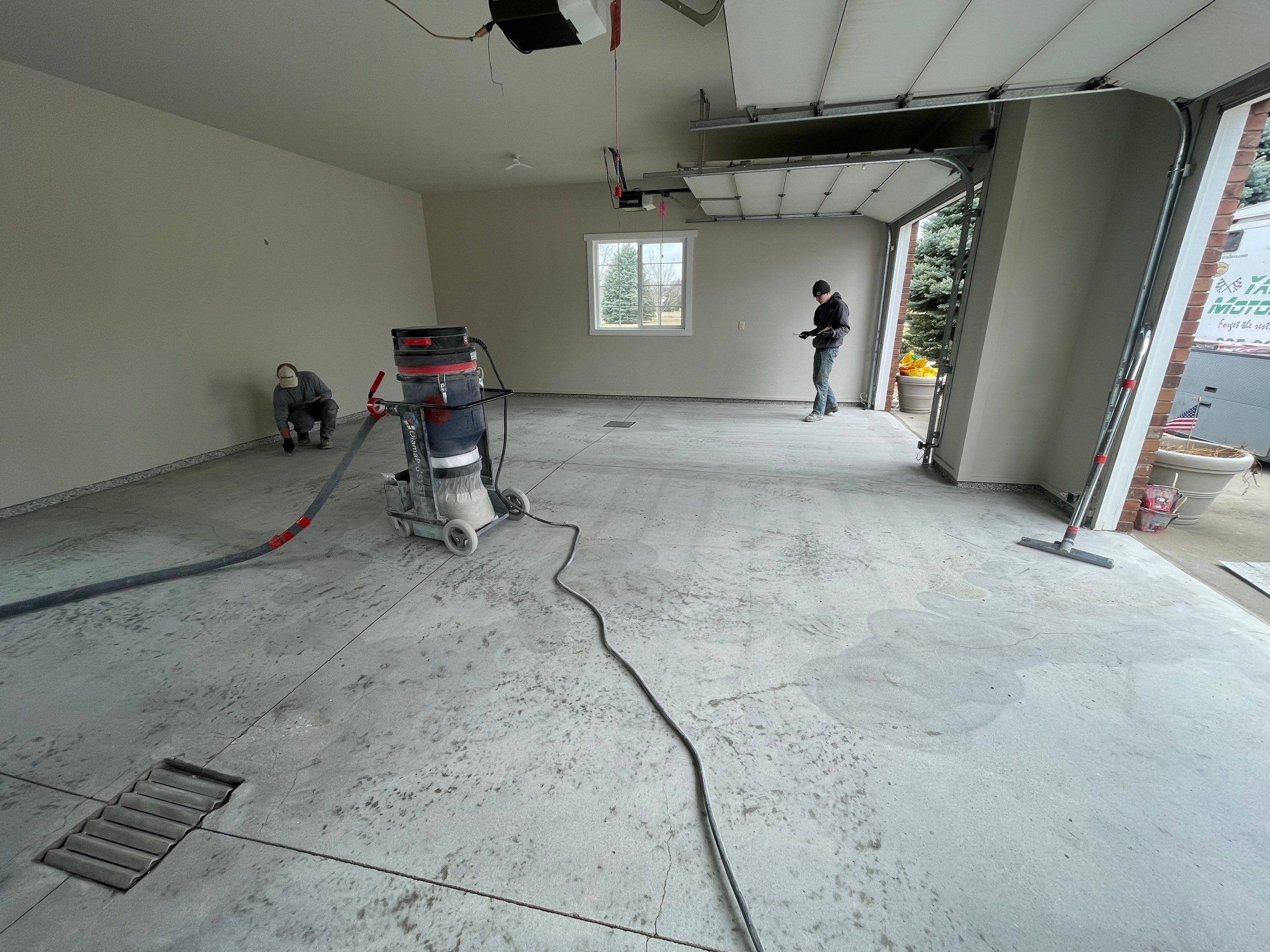 Garage transformation in Yankton by Select Painting, Coatings & Garage Cabinets