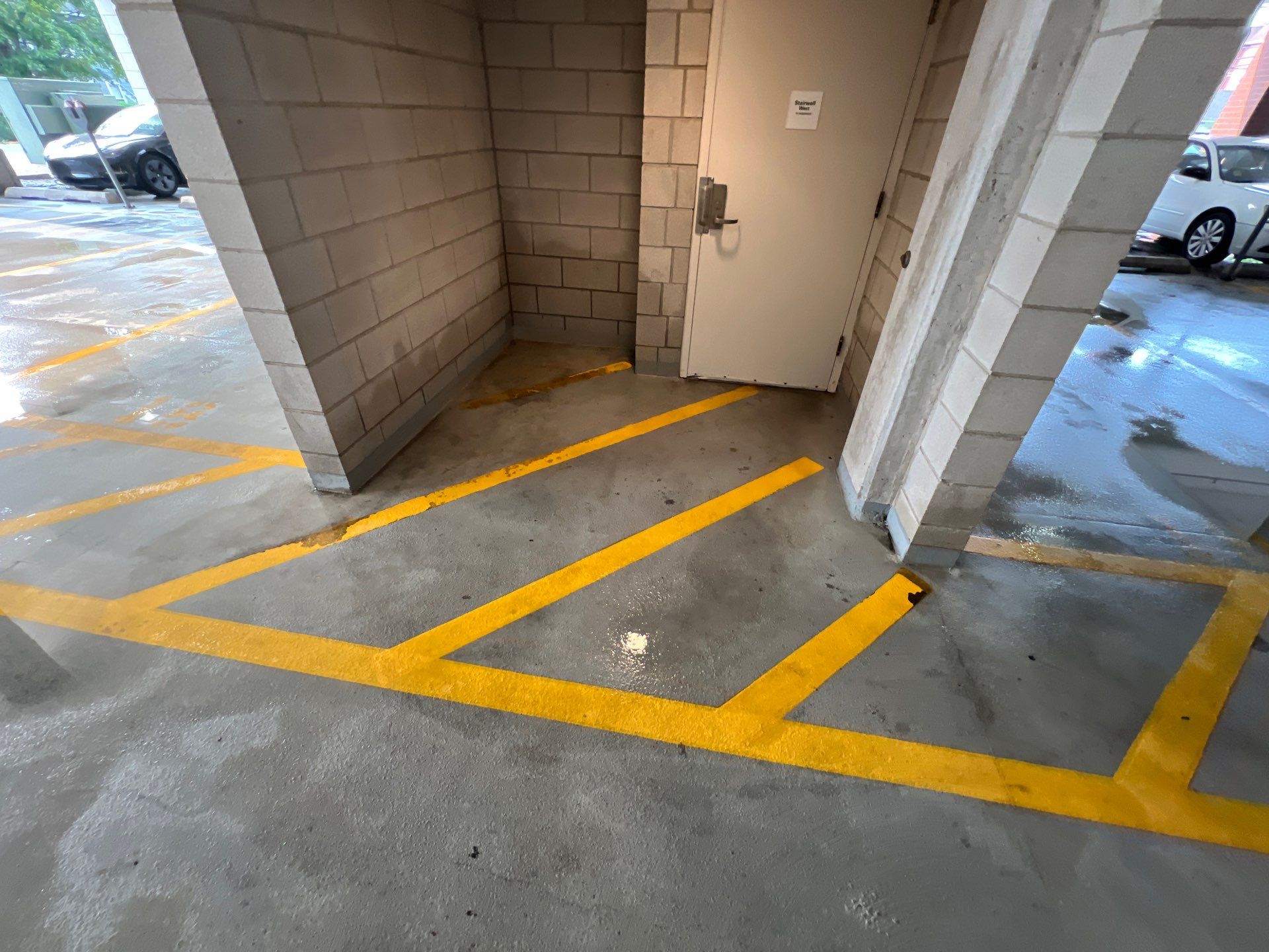 Parking garage using Hot water by Northern Power Washing LLC.