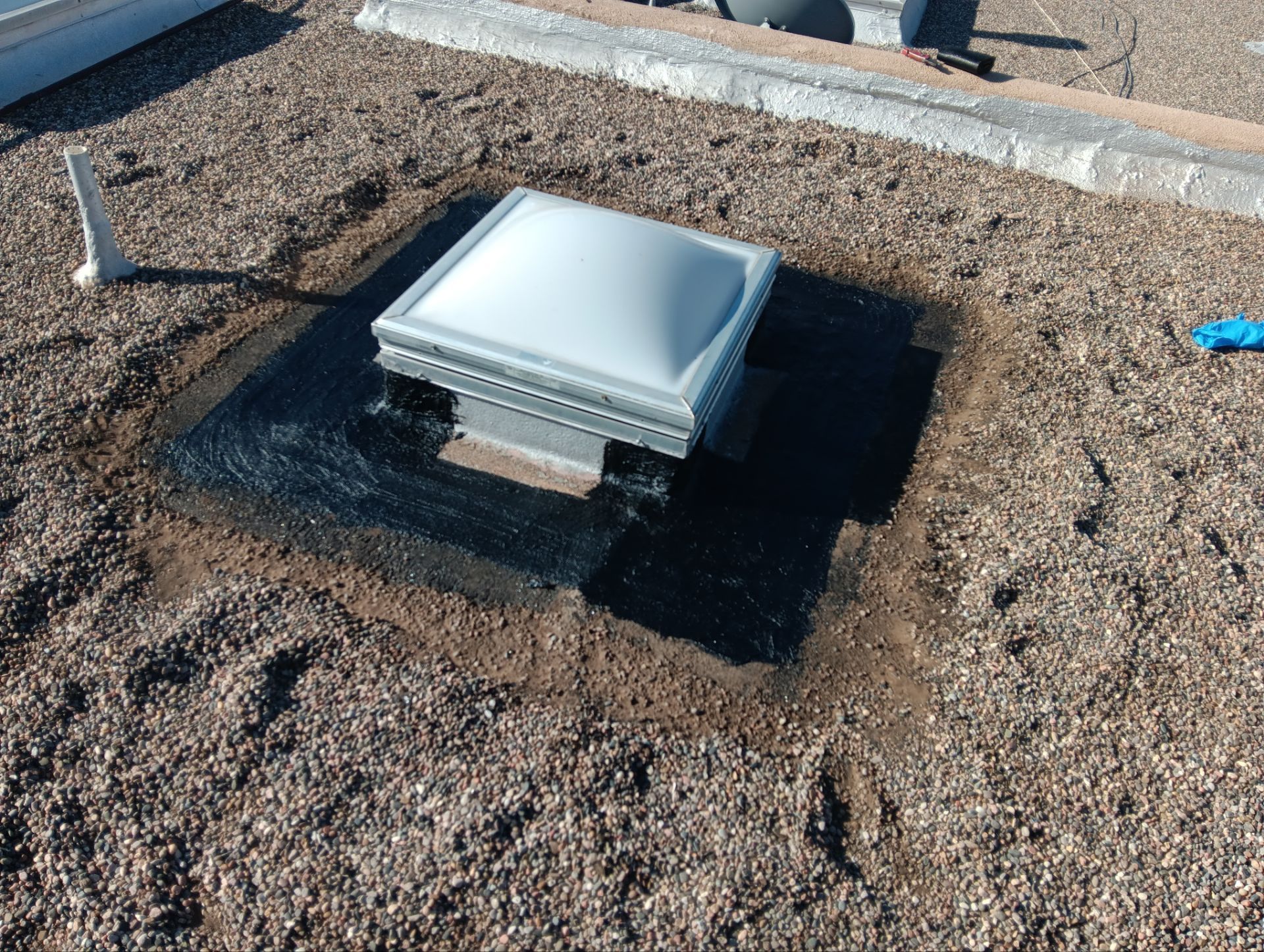 Roof Maintenance and Low-E Tempered Glass Skylight Replacement on Gravel Roof in Northwest Albuquerque by Doyle Roof Masters Inc