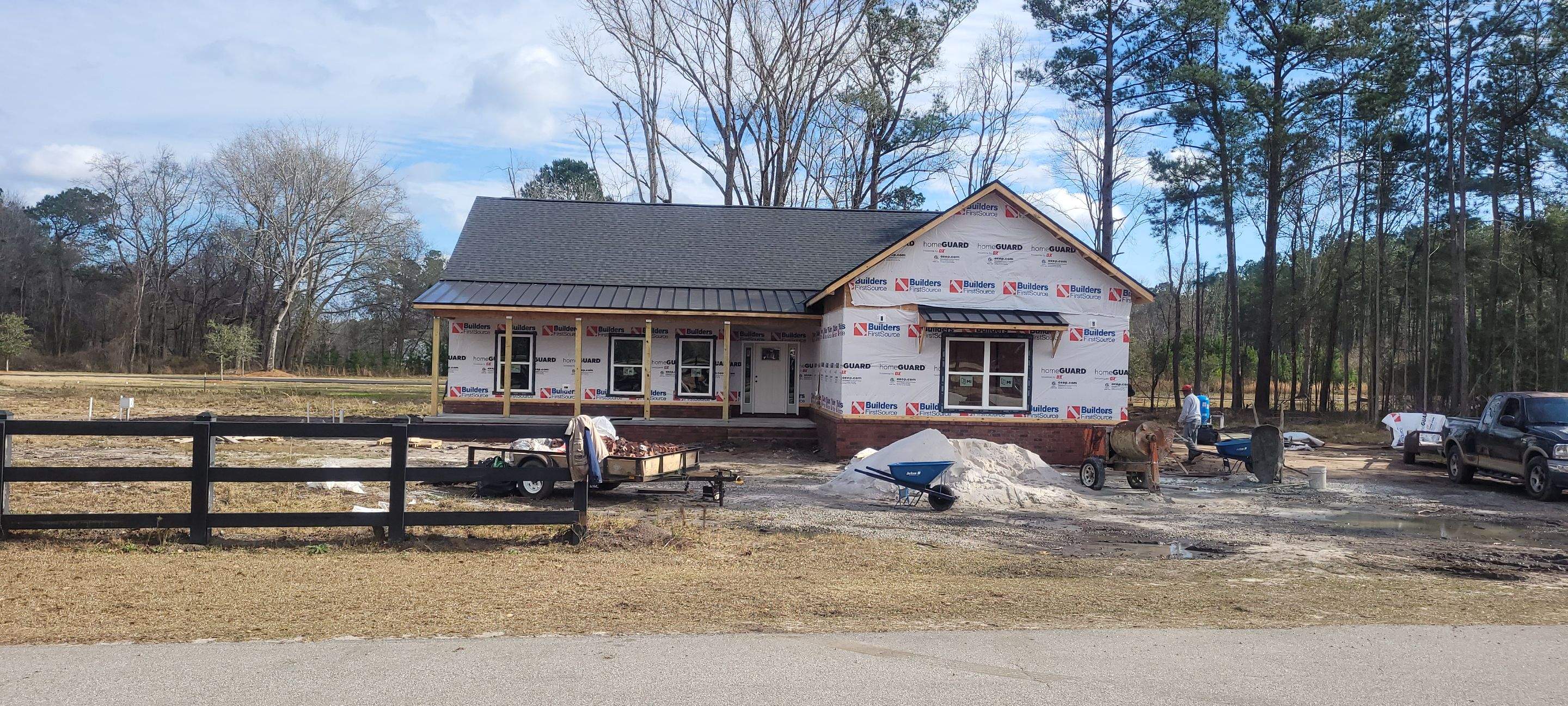 New Home Construction using brick and vertical vinyl by Cornerstone Home Builders, LLC