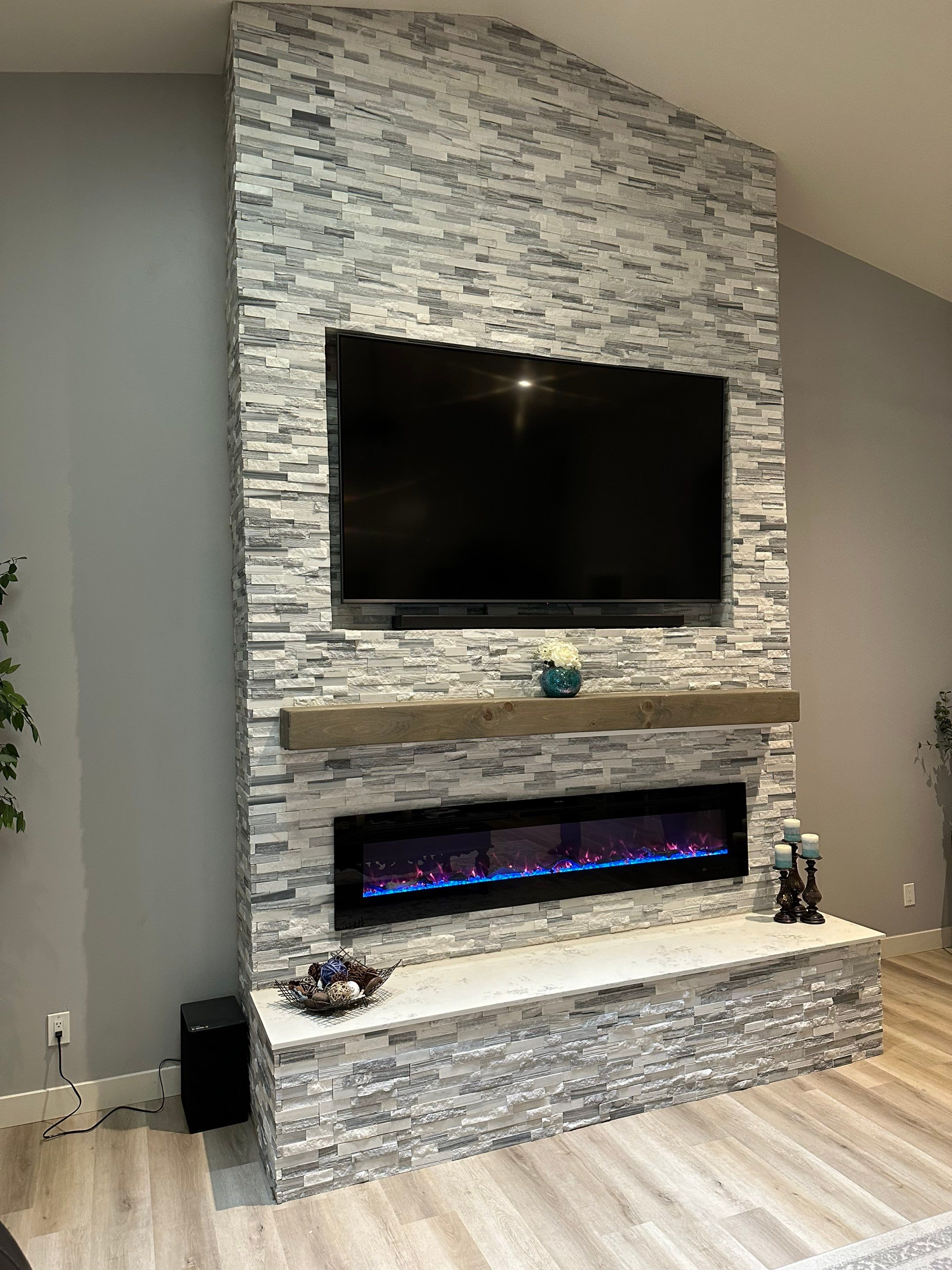 Stacked Stone Electric Fireplace by Footprints Floors of Chandler 