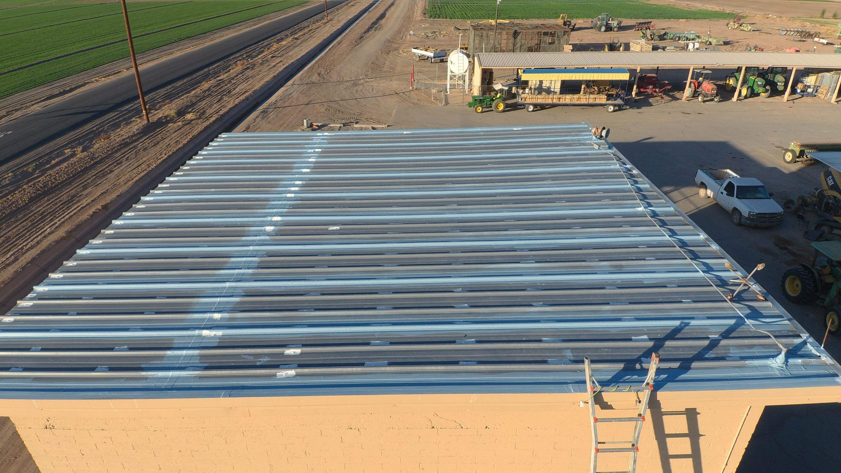 Metal roof restoration on commercial roof using Conklin Benchmark/PUMA XL fabric and coating by Straight Edge Roofing Inc