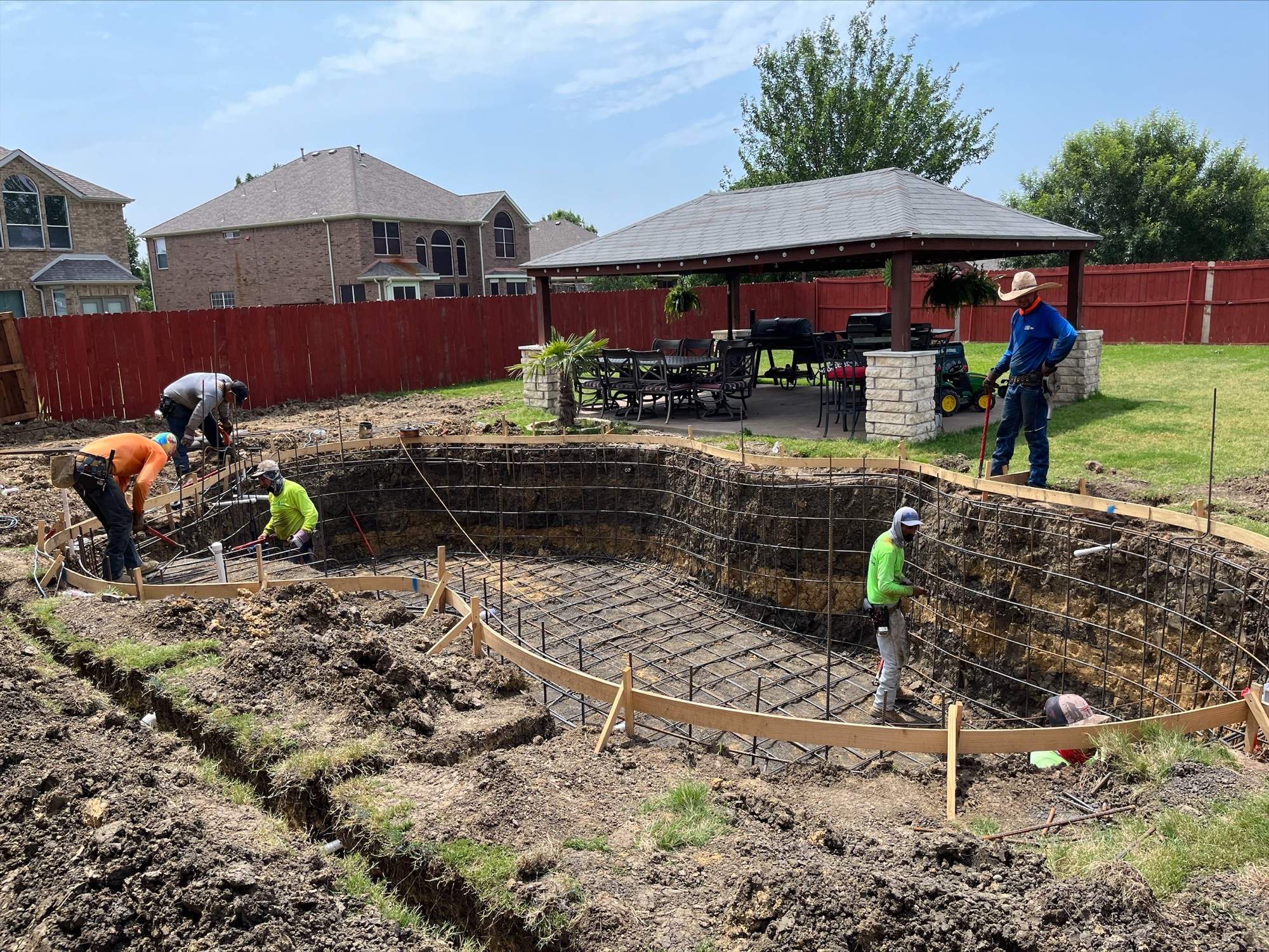 Freeform Pool with Tanning Ledge and Stone Decking by Pinnacle Pools and Spas - DFW