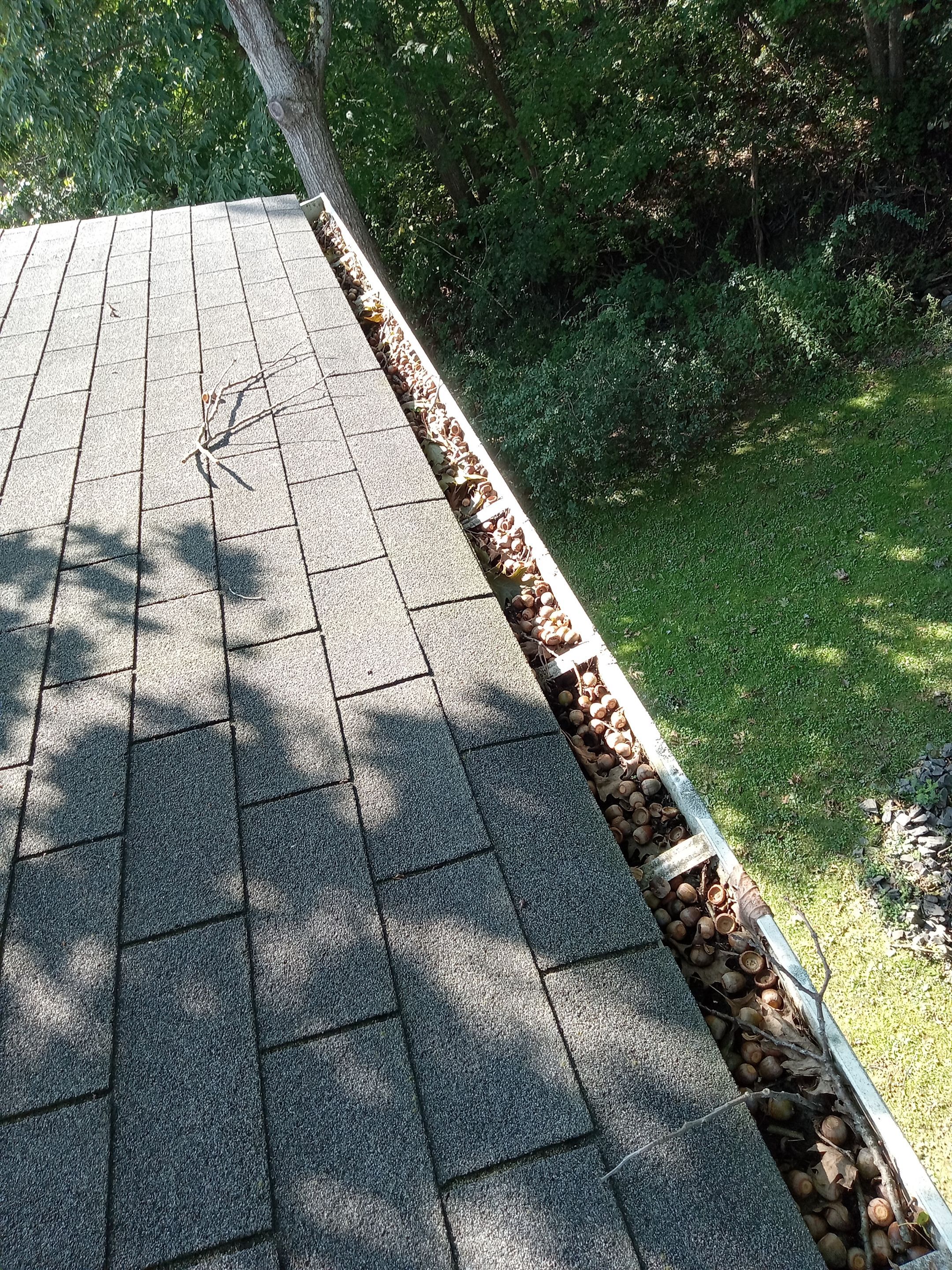 Commercial gutter cleaning Burlington before photo with filled gutters