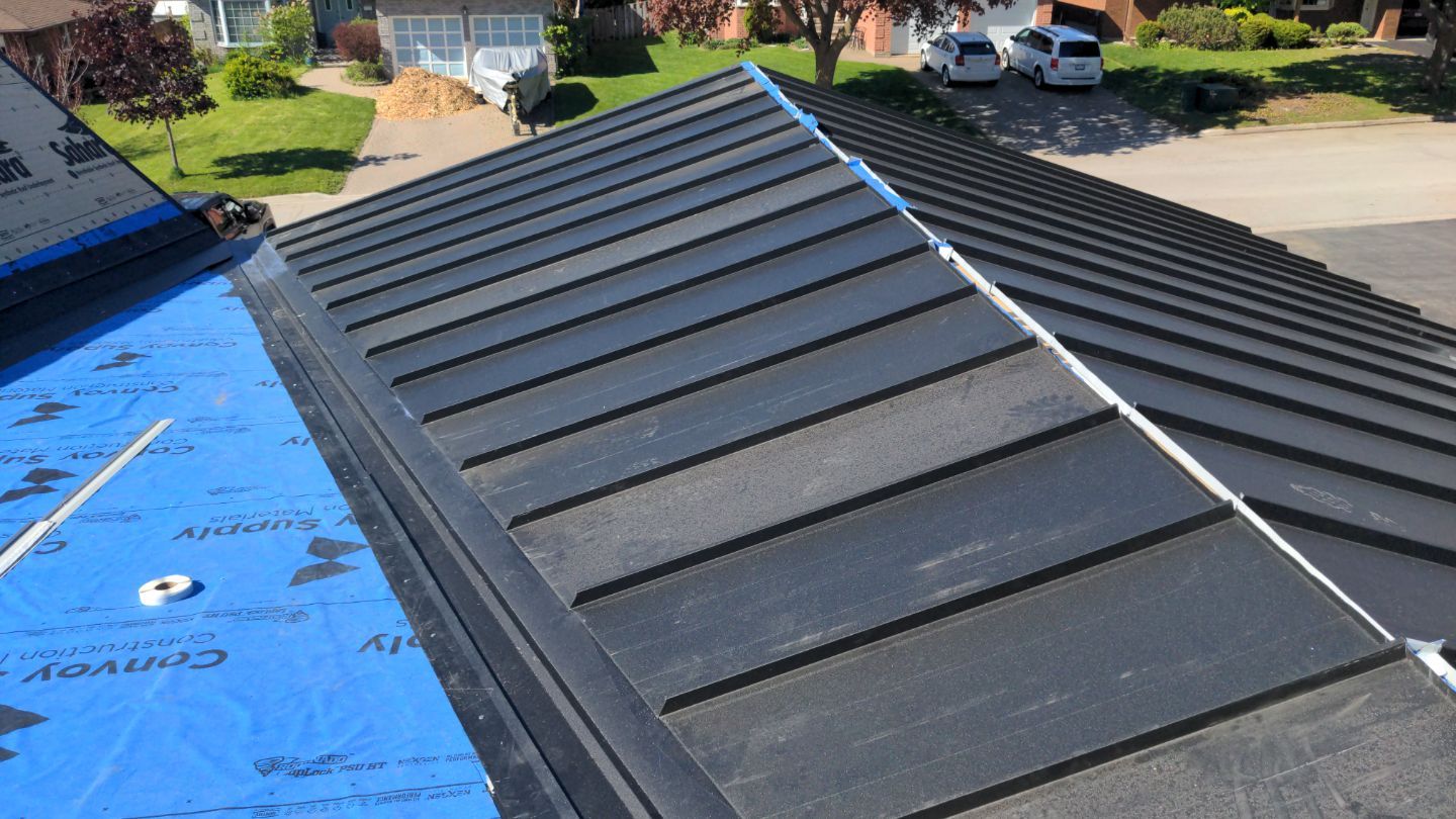 Residential Roofing Installation using 16" Standing Seam Panels by Jay Carter Roofing & Sheet Metal