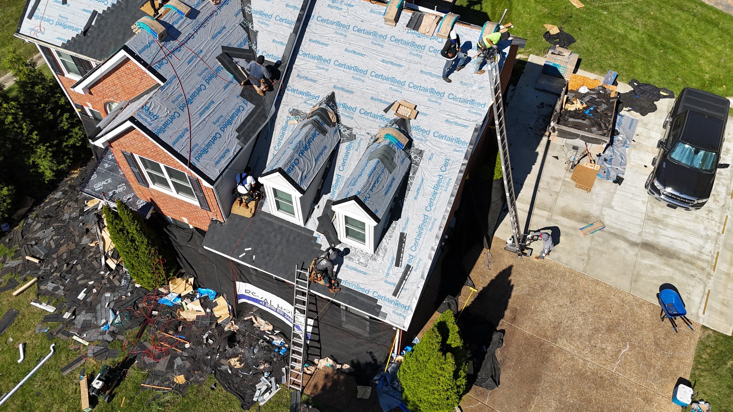 Charcoal Black Re-Roof & Gutters by Royal House LLC