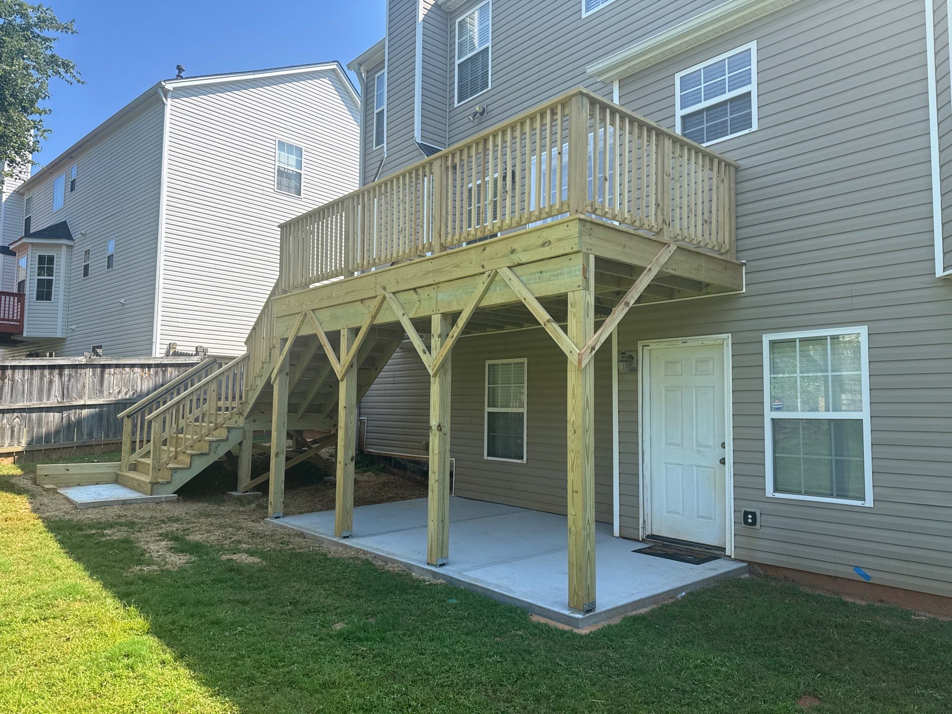 Backyard Deck Expansion & Custom Staircase Installation in Suwanee. by Swift Home Renovations
