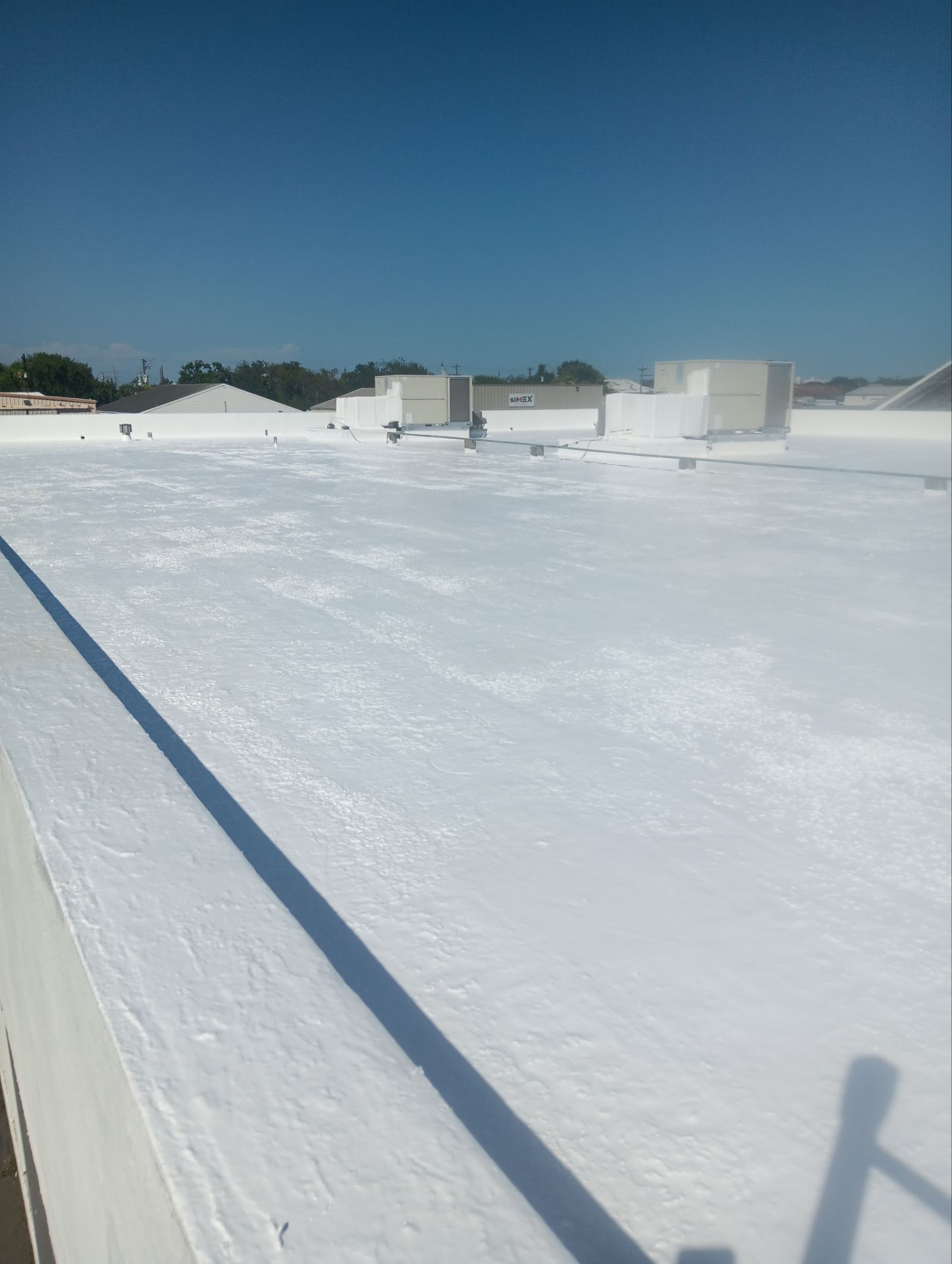 Dirty leaking Gravel Roof by Bayfront Roofing and Construction