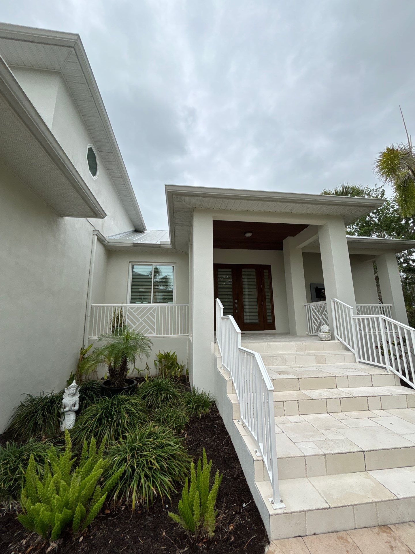 6-Inch White Seamless Gutters Installation in Siesta Key FL by Gutter Professors