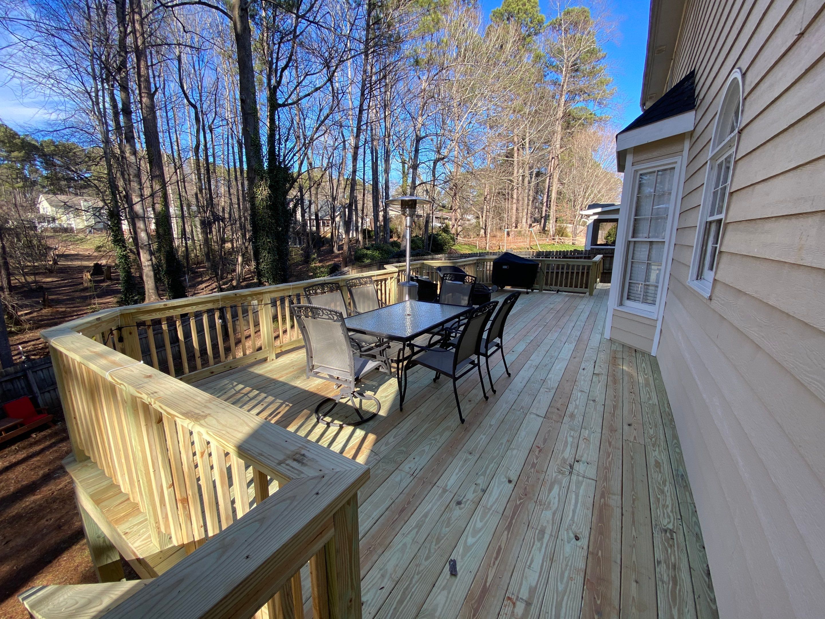 Elevated Pressure-Treated Wood Deck Replacement and Staircase in Duluth by Swift Home Renovations