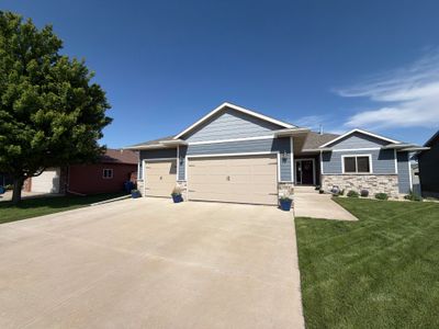 Full Exterior Home Painting on Blue Lap Siding in Sioux Falls