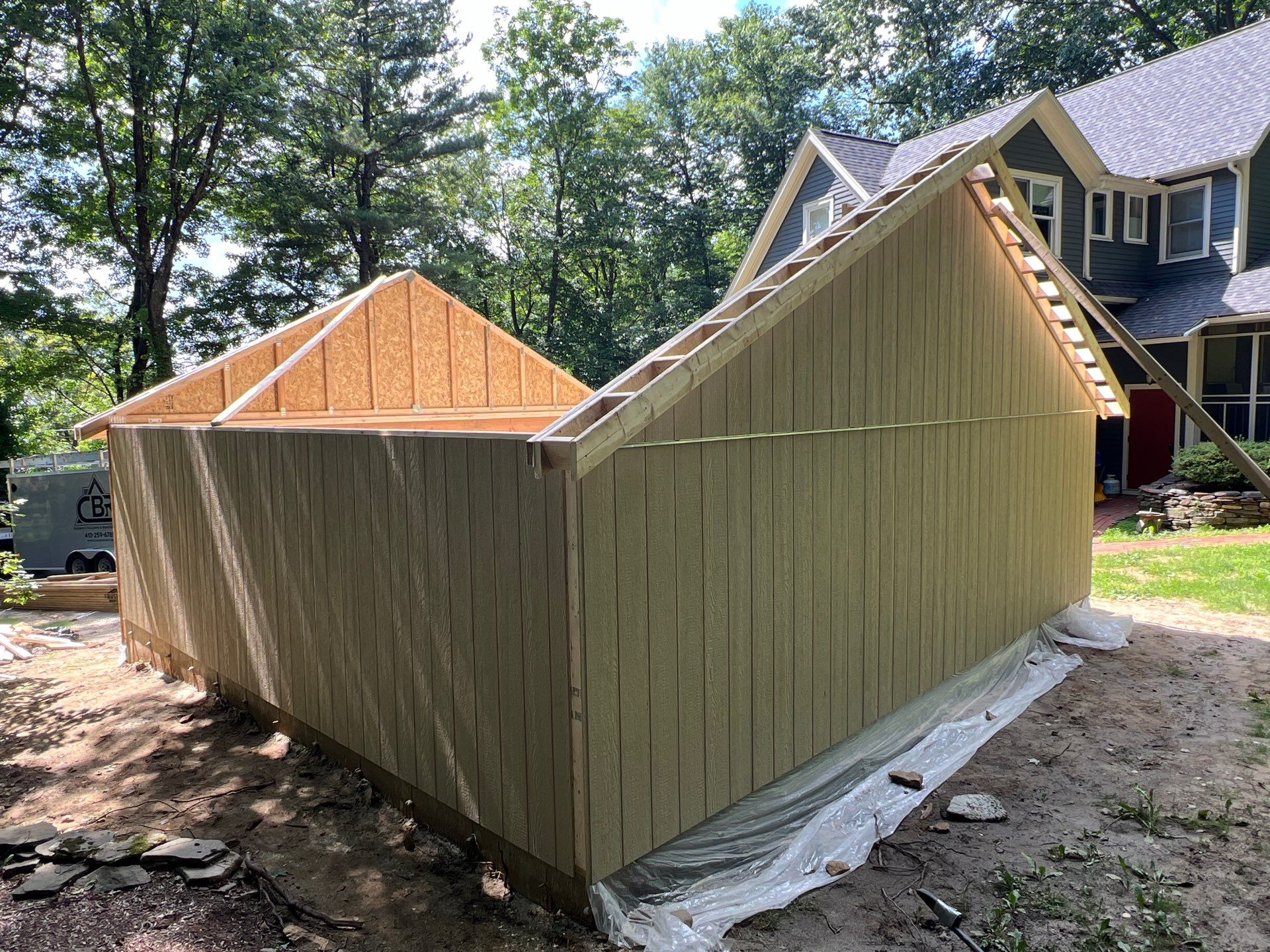 Garage using LP SmartSide Panel Siding by Chagnon Building & Remodeling LLC