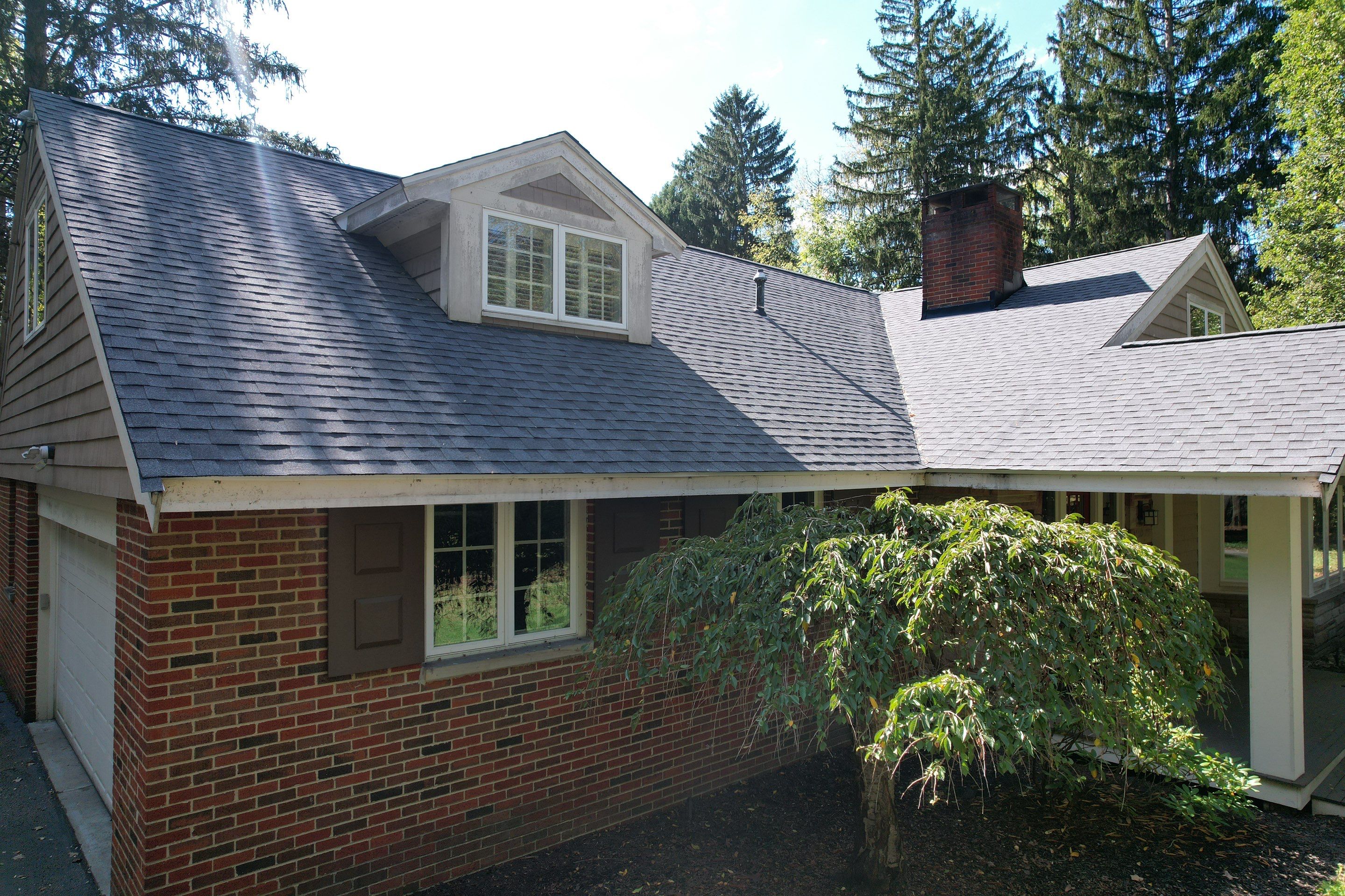 Moreland Hills Roof + Gutters Replacement by Atlas Roofing & Restoration