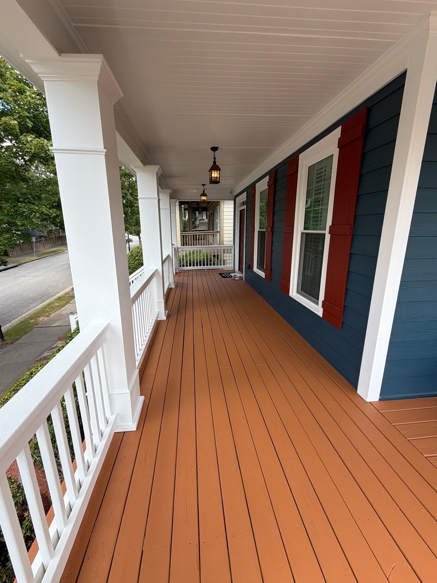 Atlanta Exterior Home Refresh with Blue Siding and Deck Staining by Swift Home Renovations 