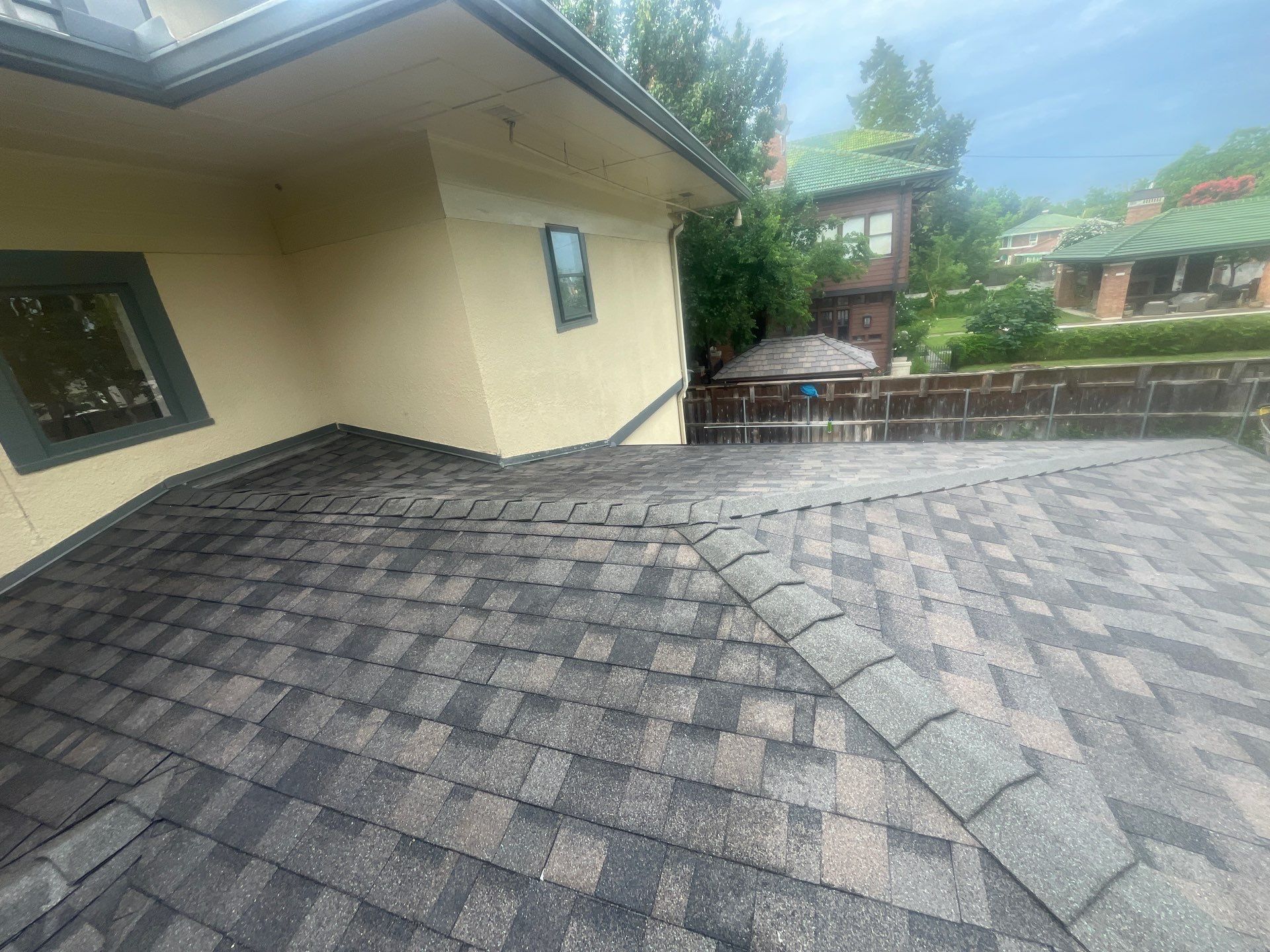 Tan exterior with IKO Driftshake by Tejas Roofworks + Restoration