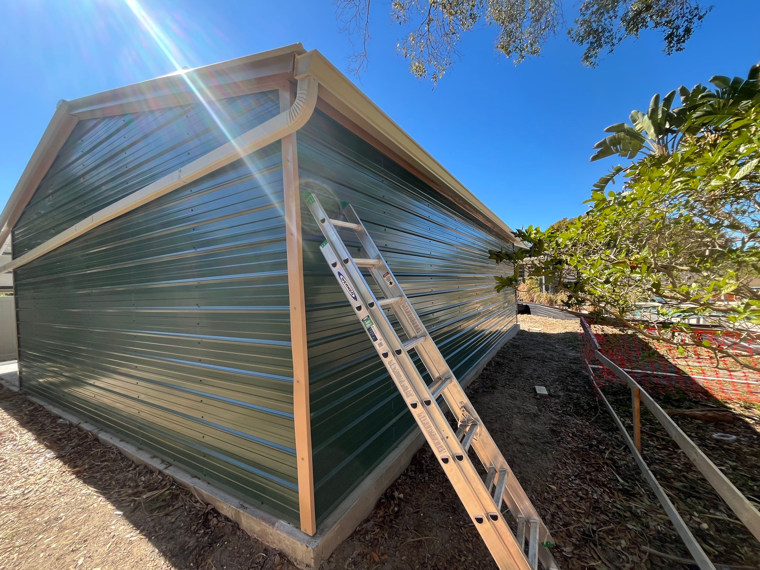 White 6-inch K-style Gutters and Down Spouts using Seamless Gutters White Down Spouts in Tampa FL by Gutter Professors