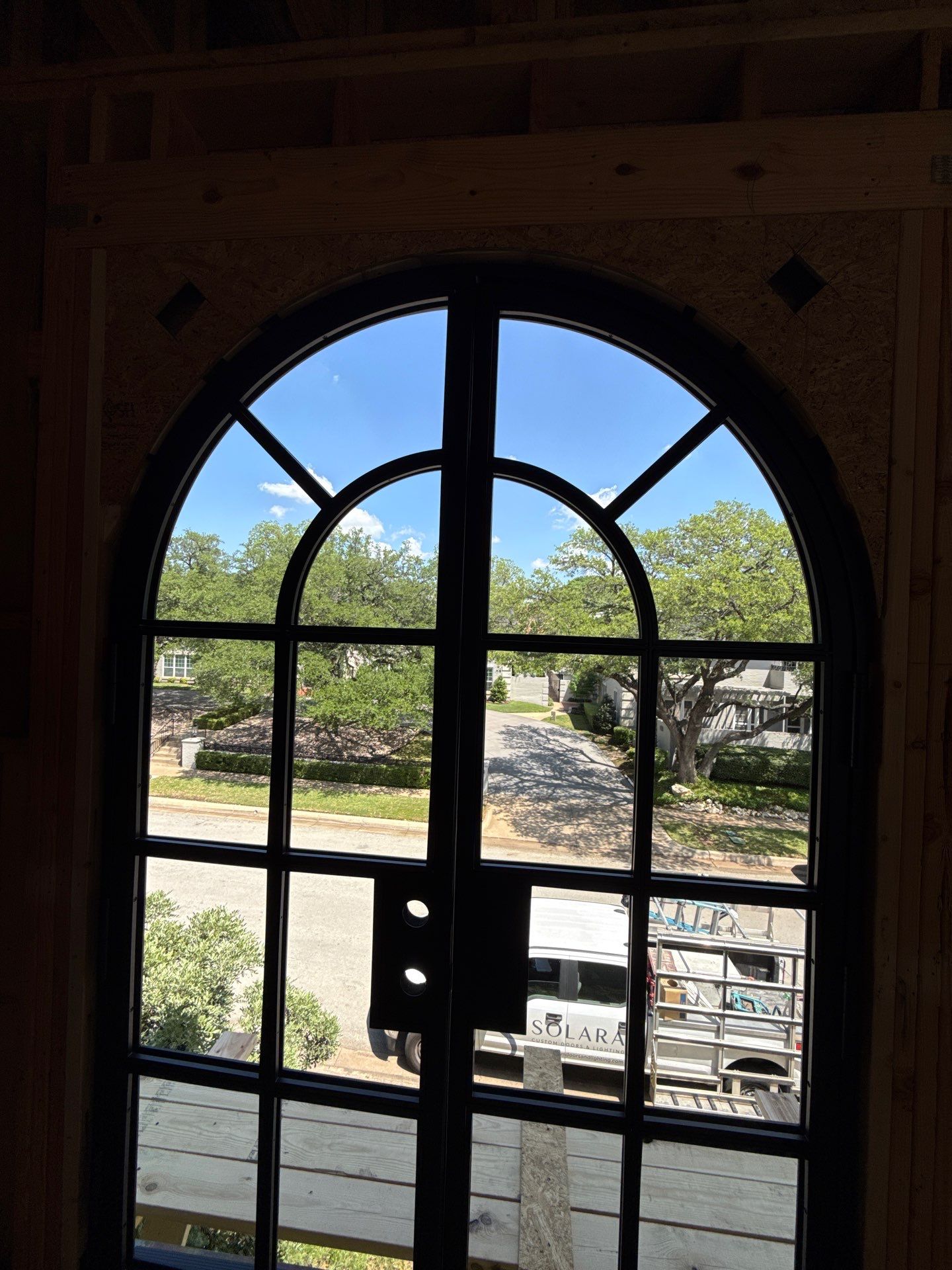 Arched Black Metal French Door Installation and Finishing in Fort Worth by Solara Custom Living