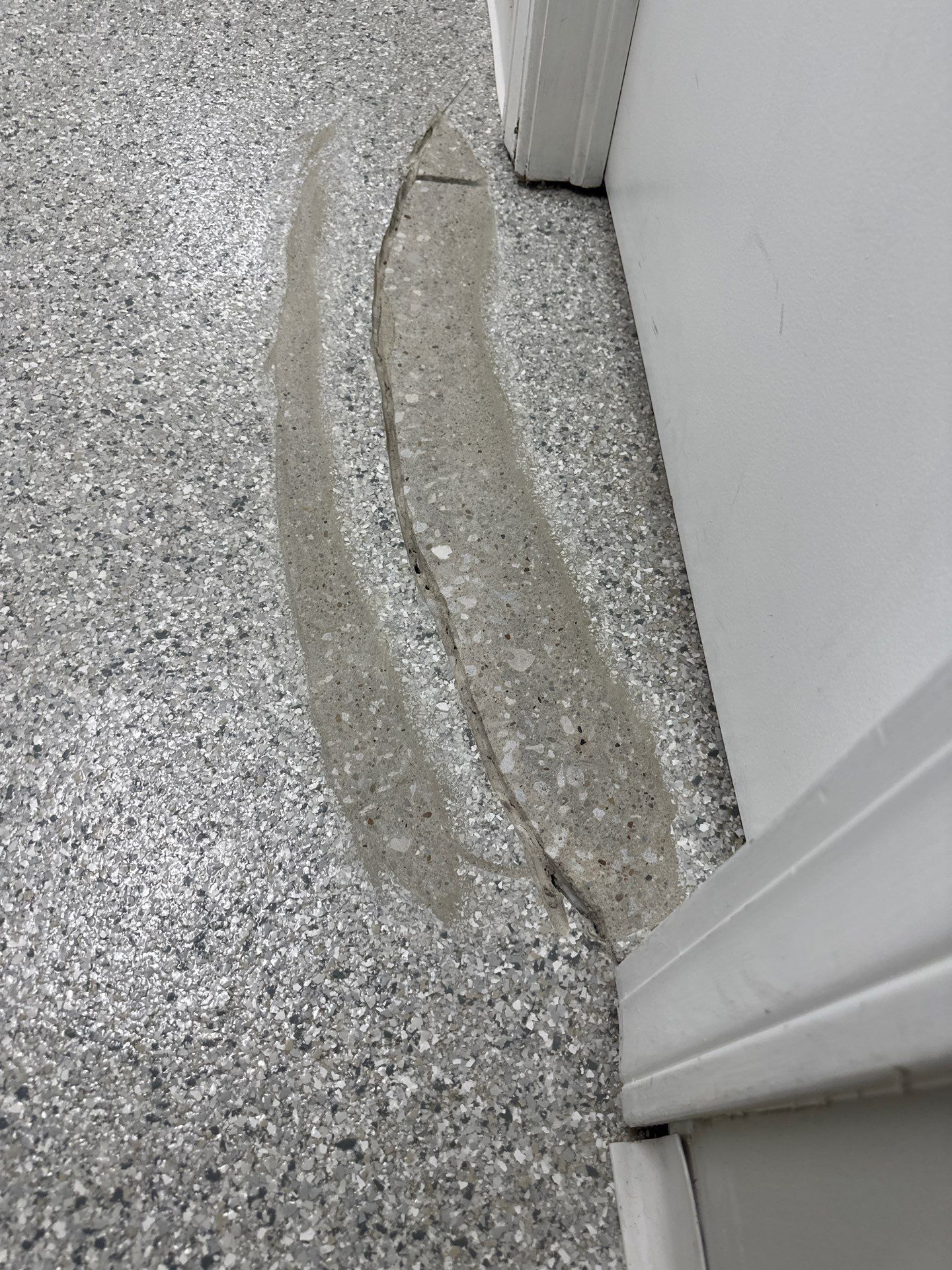 Medina Cracked basement floor with Epoxy by Beck Restoration Management Group